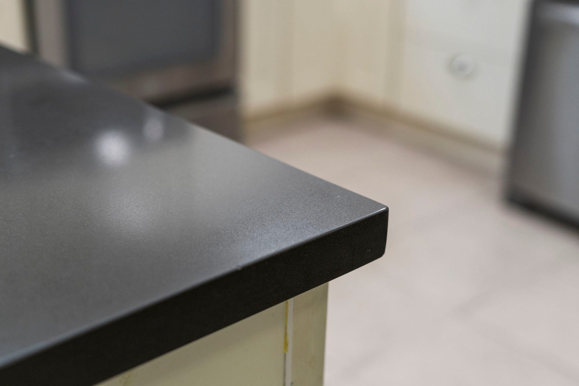2915 Cane Field Drive, Sugar Land, TX 77479 Sleek dark countertops add a modern contrast to the white cabinetry, creating a clean & polished finish throughout the kitchen.