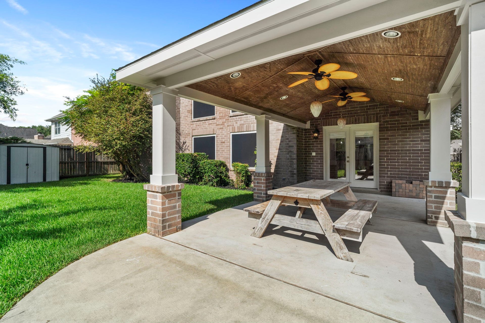 2915 Cane Field Drive, Sugar Land, TX 77479 You're right we need each caption to add something new.
For this angle, Id use:
**French doors provide easy access from the home to the backyard & covered patio.