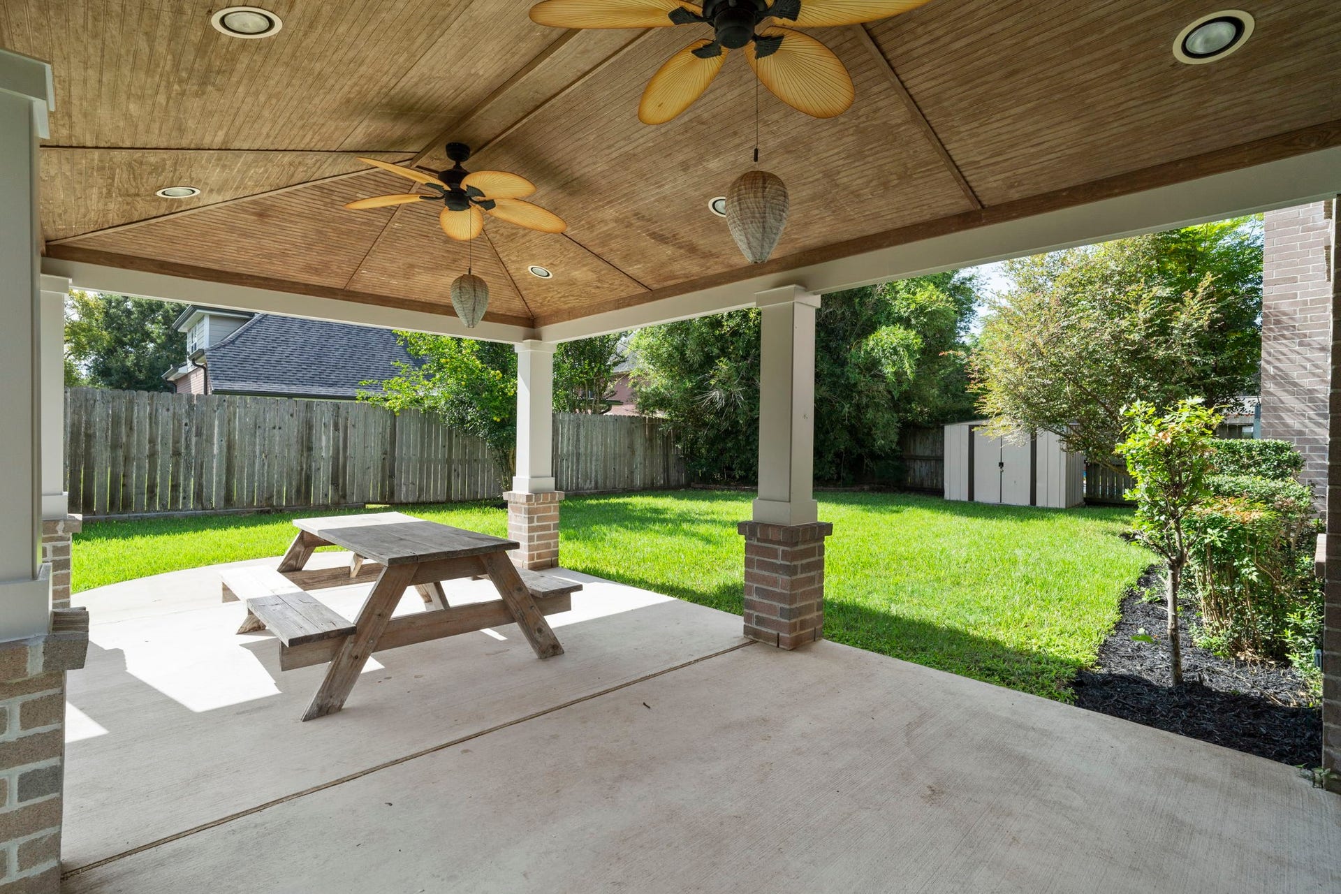 2915 Cane Field Drive, Sugar Land, TX 77479 A spacious covered patio extends the living space outdoors, overlooking the private backyard.