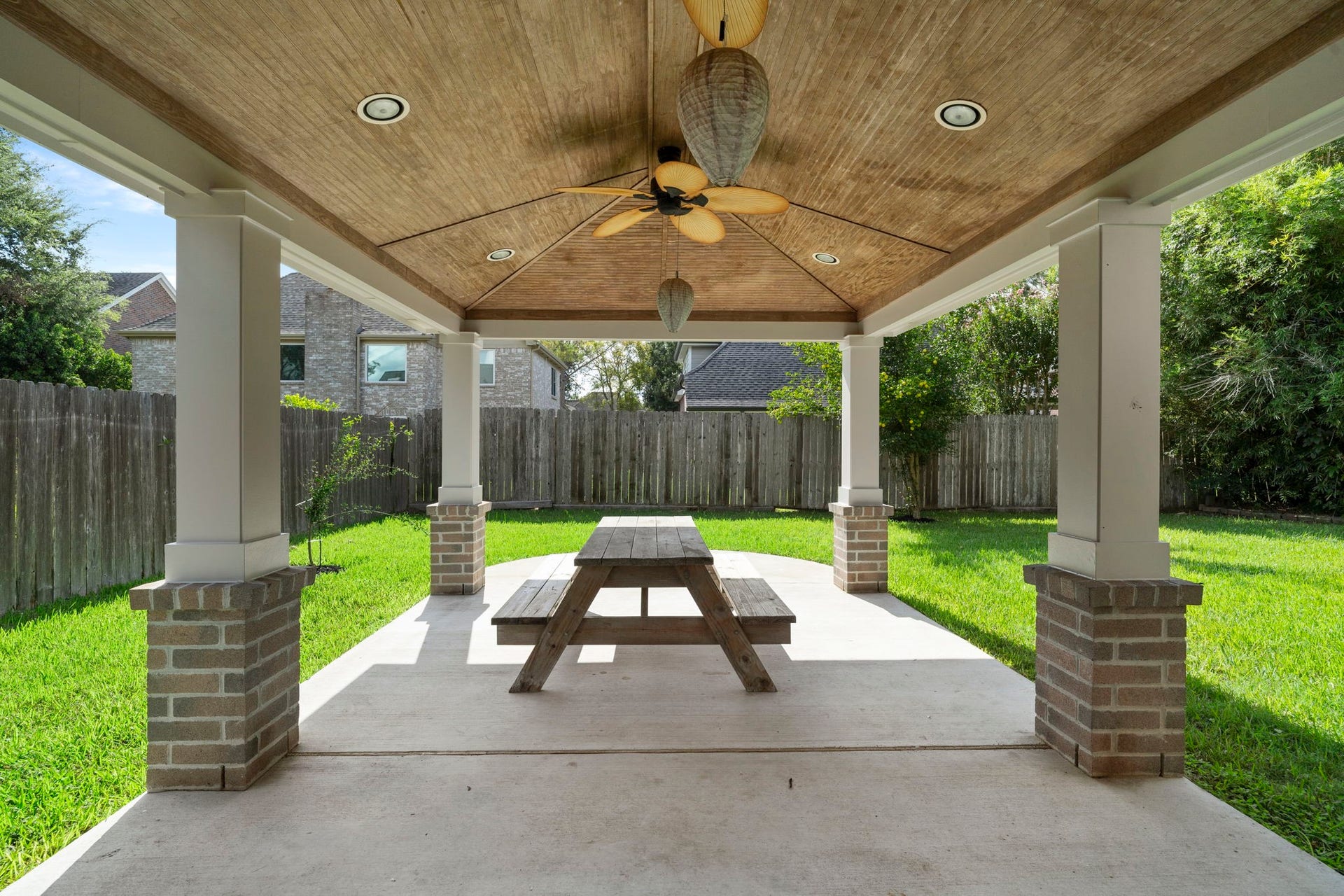 2915 Cane Field Drive, Sugar Land, TX 77479 Expansive covered patio with a wood-planked ceiling & plenty of space for outdoor dining & relaxing.