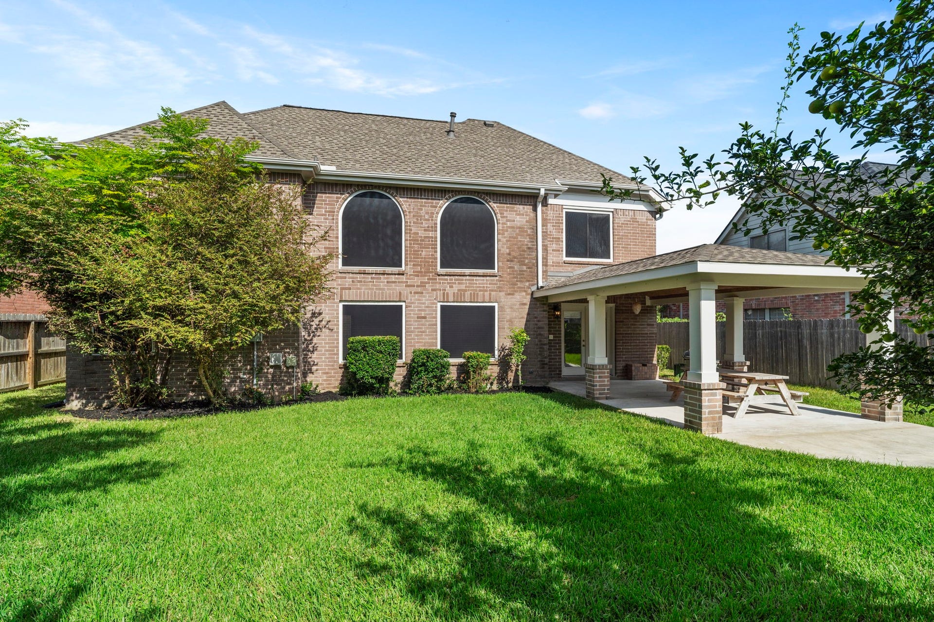 2915 Cane Field Drive, Sugar Land, TX 77479 Generous backyard offers plenty of green space with mature trees providing natural shade.