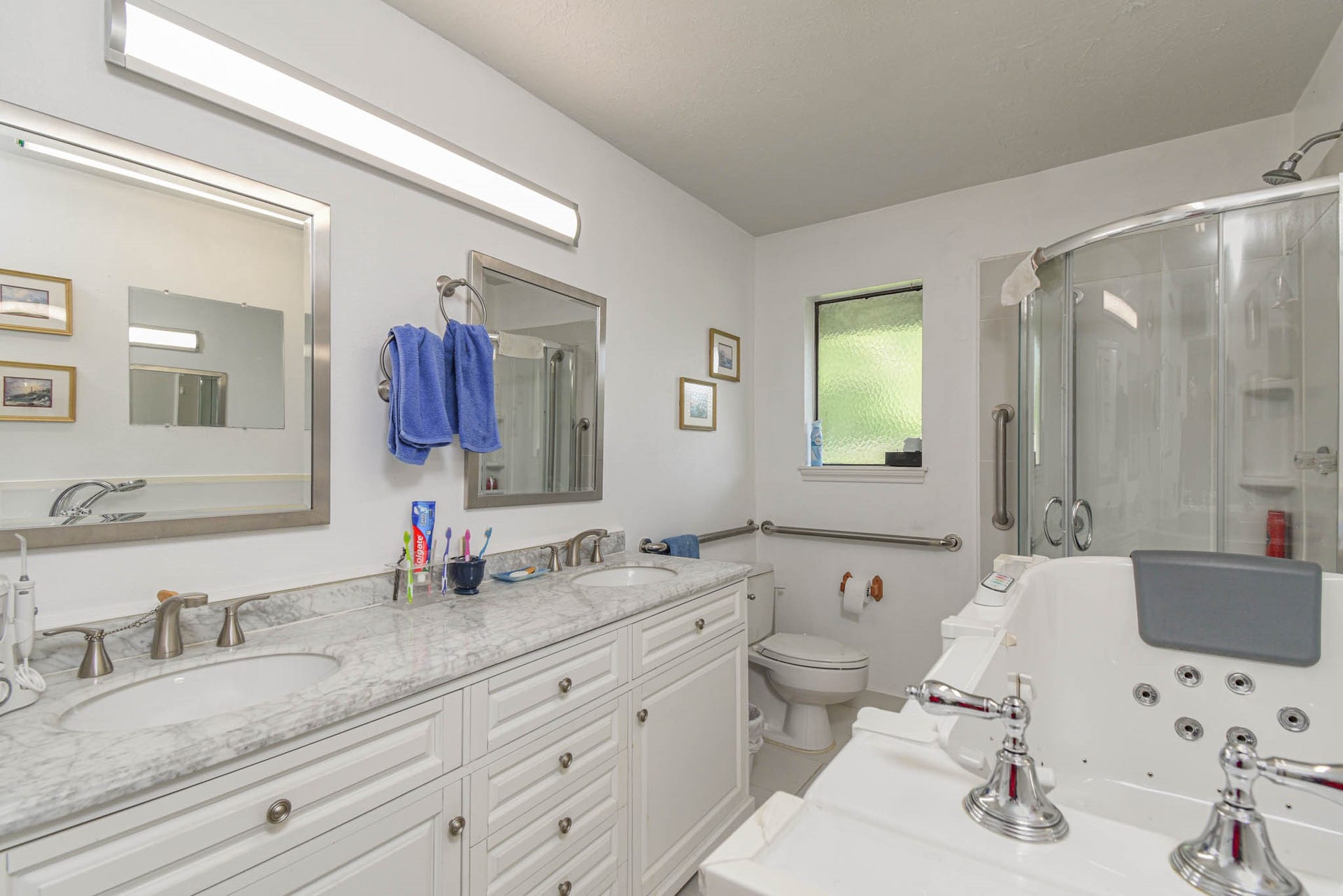 4503 Allen Genoa Road, Pasadena, TX 77504 UPDATED PRIMARY BATHROOM: WALK IN SPA BATH TUB, SEPARATE SHOWER, DOUBLE SINK, MARBLE VANITY & NEW CABINETS