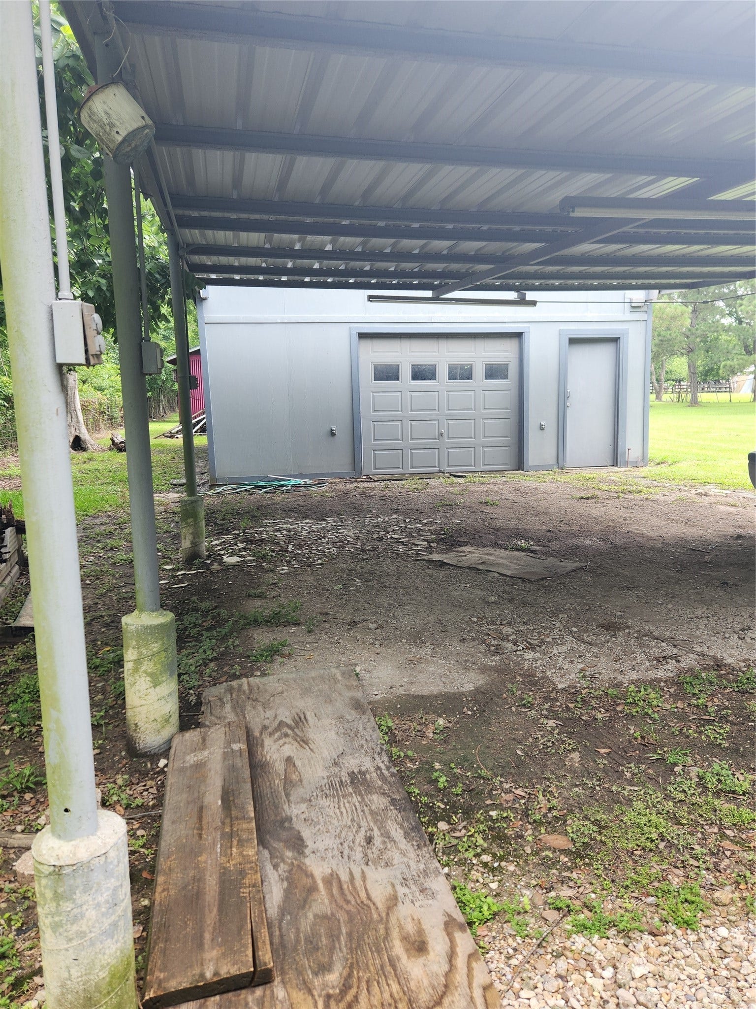 4503 Allen Genoa Road, Pasadena, TX 77504 UNDER CARPORT FACING DETACHED GARAGE