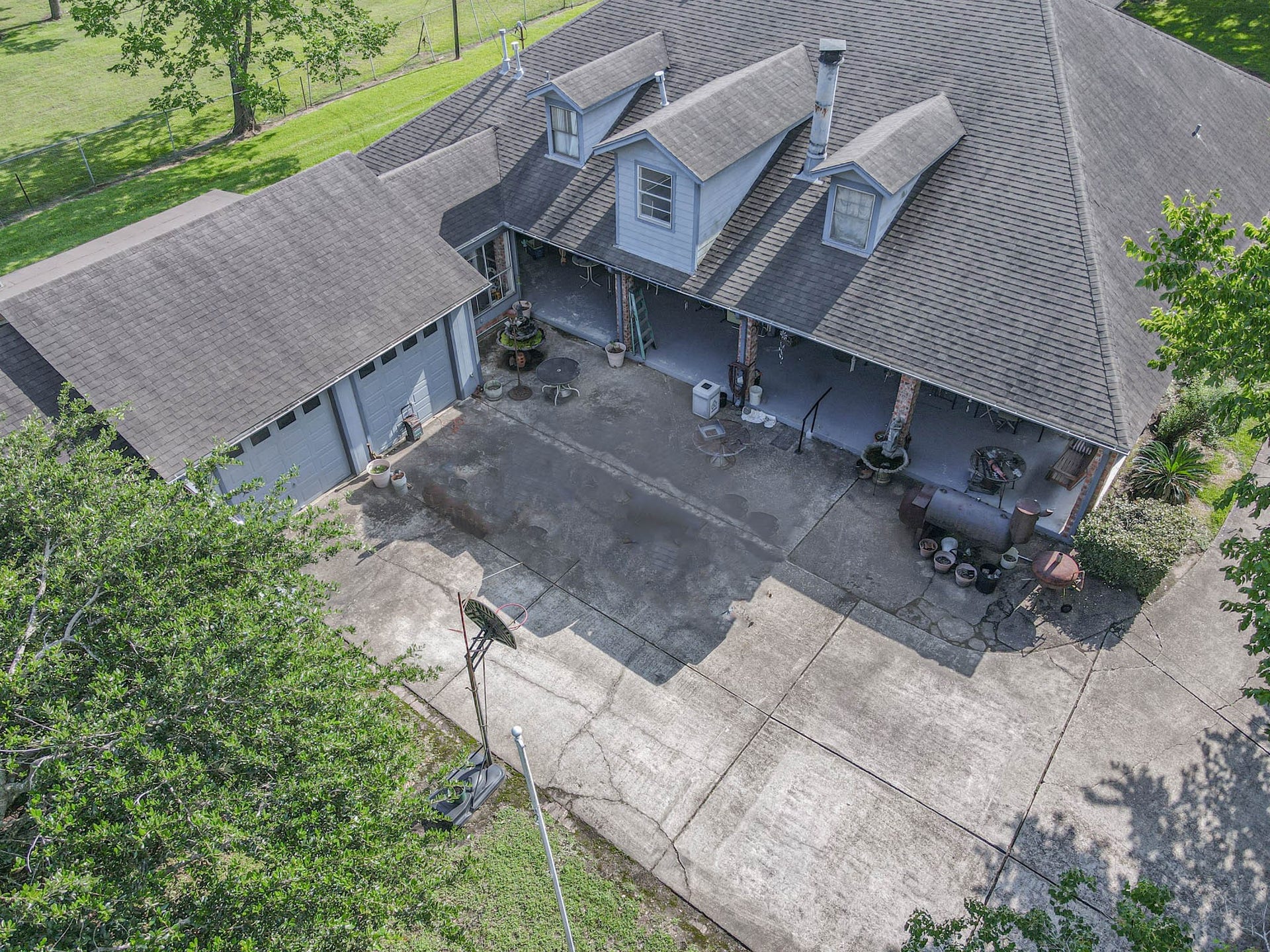 4503 Allen Genoa Road, Pasadena, TX 77504 AERIAL VIEW OF 2 CAR ATTACHED GARAGE, SUN ROOM OR WORKSHOP (BETWEEN HOME & GARAGE), TONS OF PARKING AND WRAP AROUND PORCH! WHAT MORE COULD YOU ASK FOR?