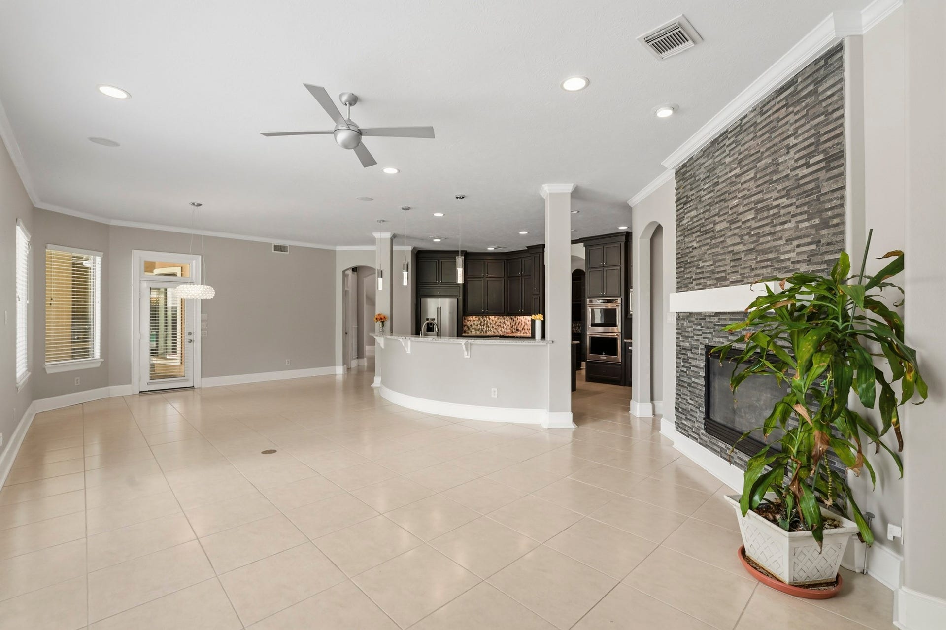 7611 Kings River Lane, Humble, TX 77346 Open living area flows seamlessly into the kitchen, creating a connected space for everyday living and entertaining.