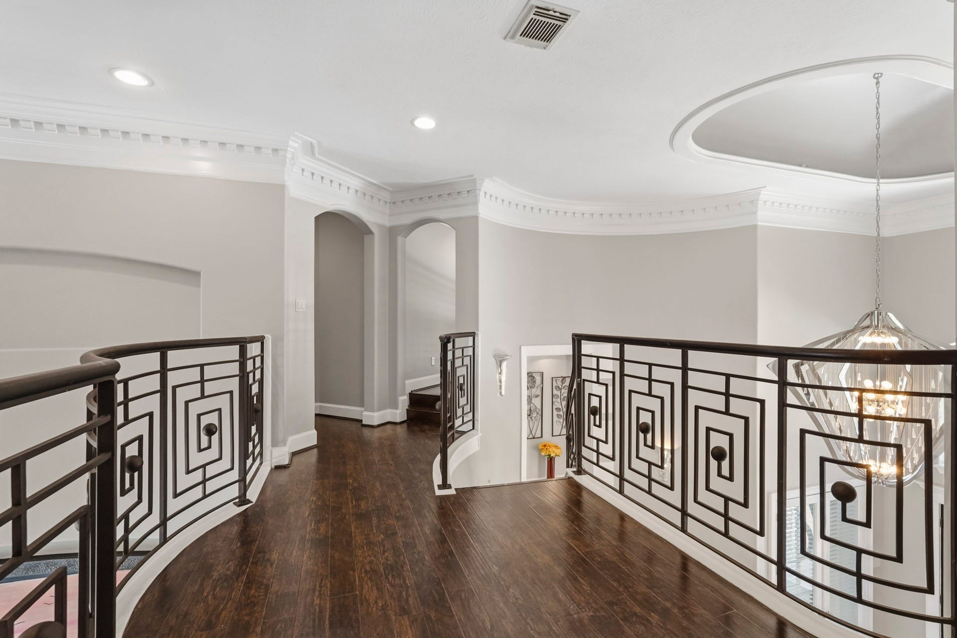 7611 Kings River Lane, Humble, TX 77346 Open second-story gallery overlooks the main level and showcases decorative iron railings, recessed lighting and the home's spacious, open design.