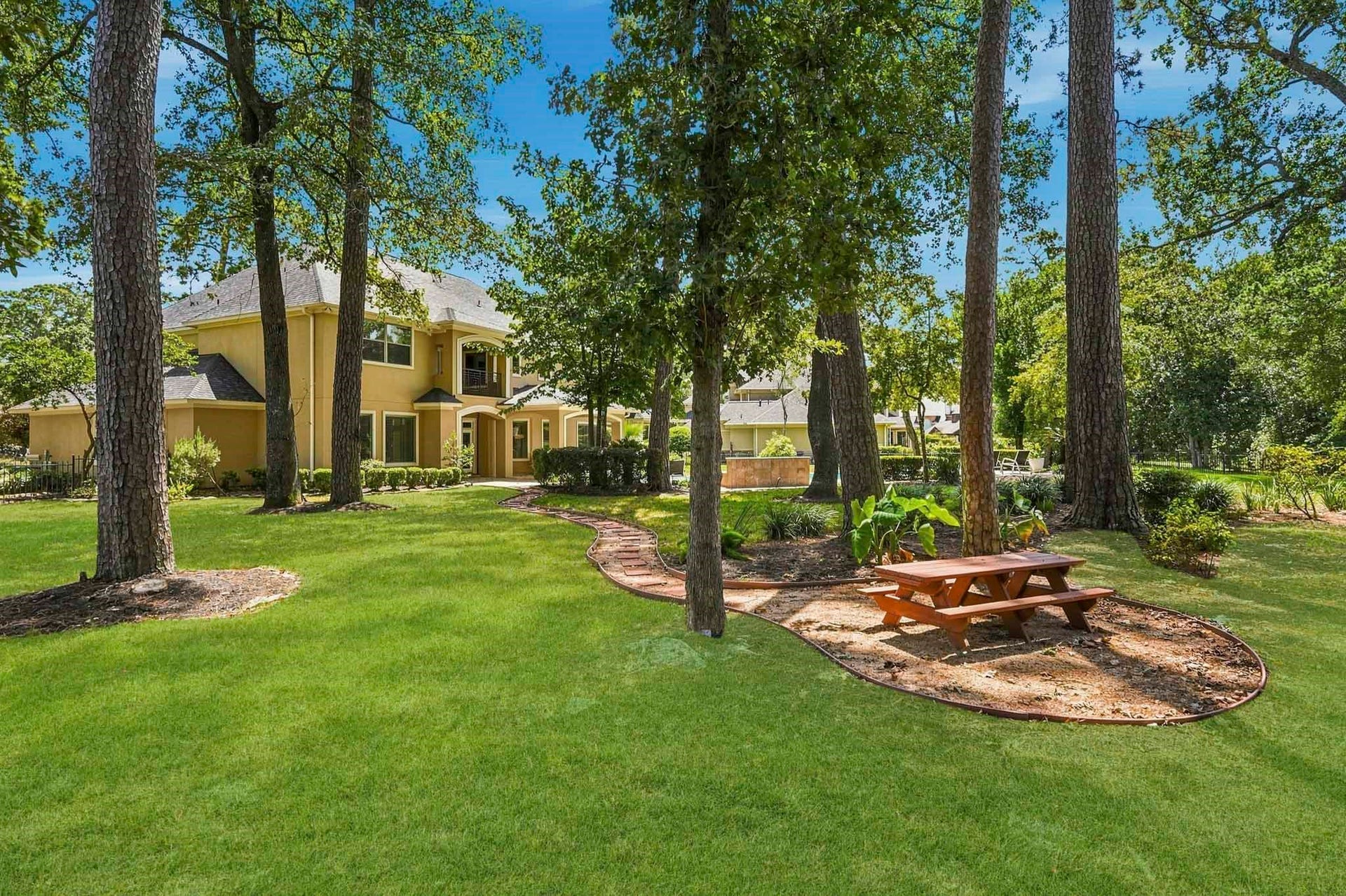 7611 Kings River Lane, Humble, TX 77346 Peaceful outdoor setting surrounded by mature trees and nature, creating a serene retreat with plenty of room to enjoy the outdoors.