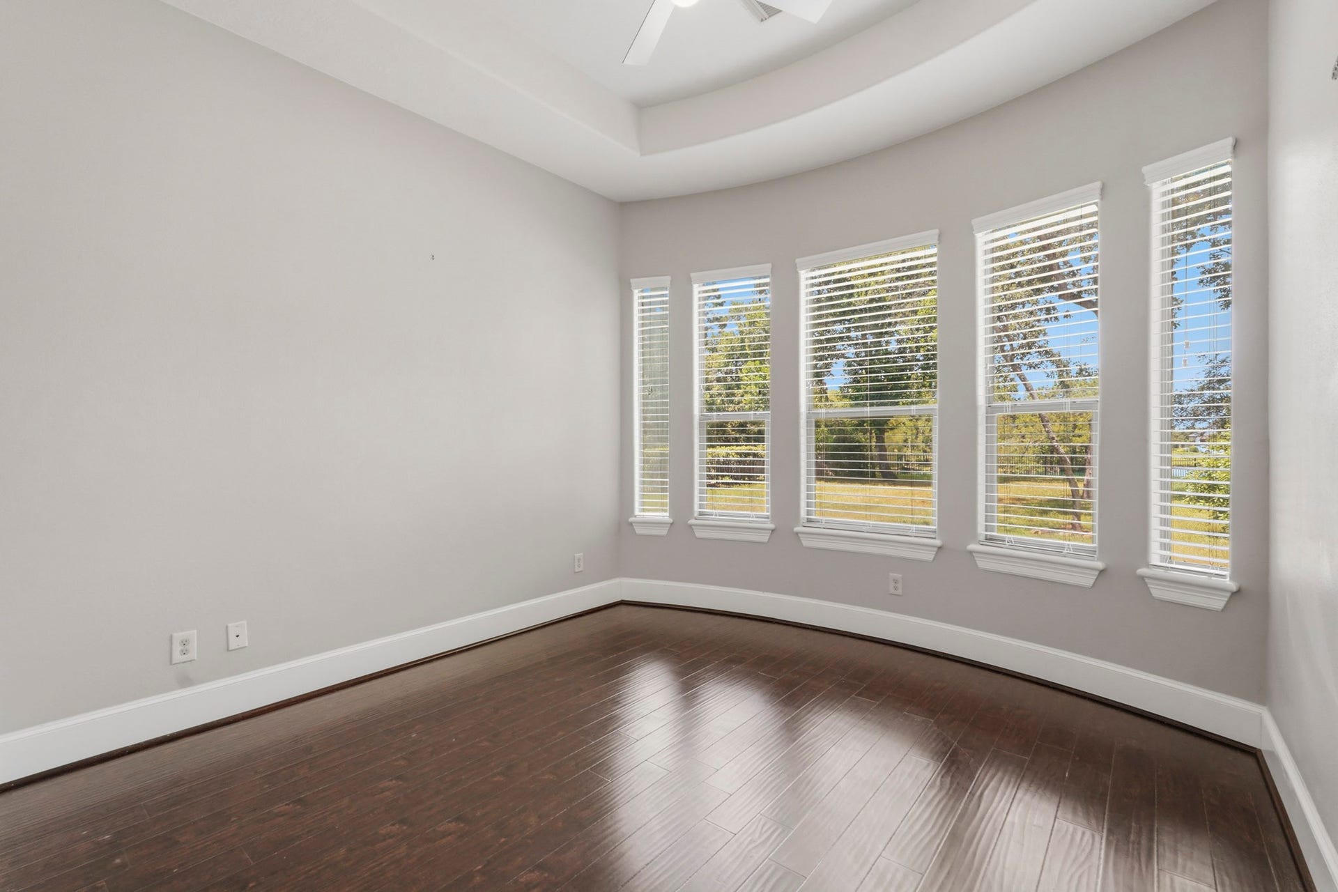 7611 Kings River Lane, Humble, TX 77346 Spacious downstairs bedroom features rich wood flooring, abundant natural light and the convenience of a private en-suite bath.