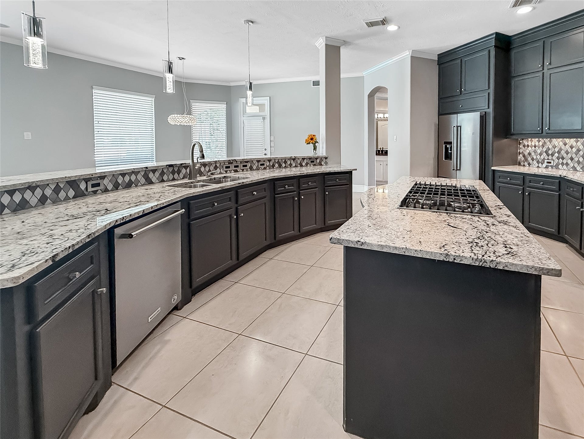 7611 Kings River Lane, Humble, TX 77346 Beautifully appointed kitchen features charcoal gray soft-close cabinetry extending throughout the space, providing exceptional storage along with stainless steel appliances and a sophisticated, updated finish.