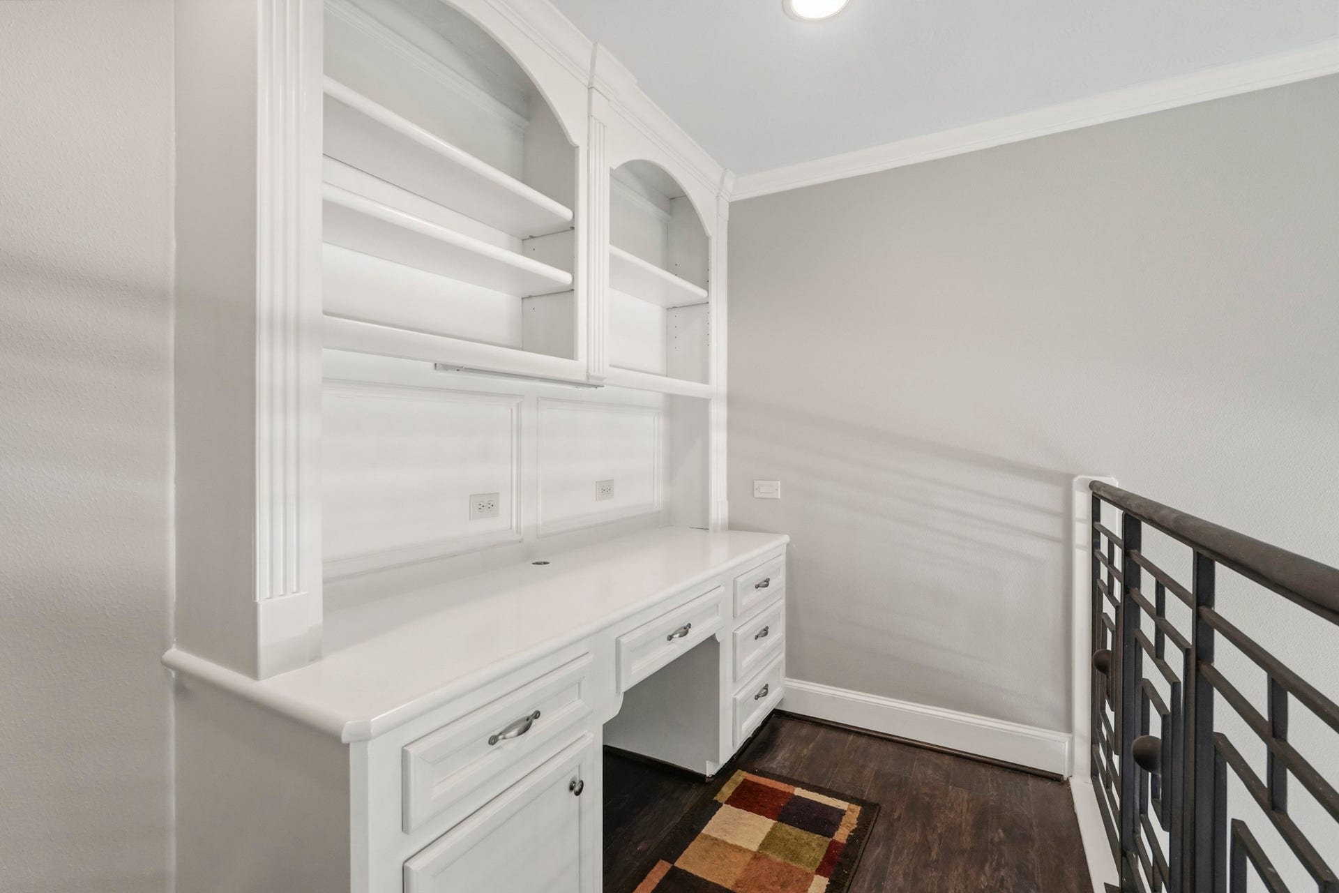 7611 Kings River Lane, Humble, TX 77346 Custom upstairs built-ins provide additional cabinetry, shelving and storage while complementing the open second-story study/library.