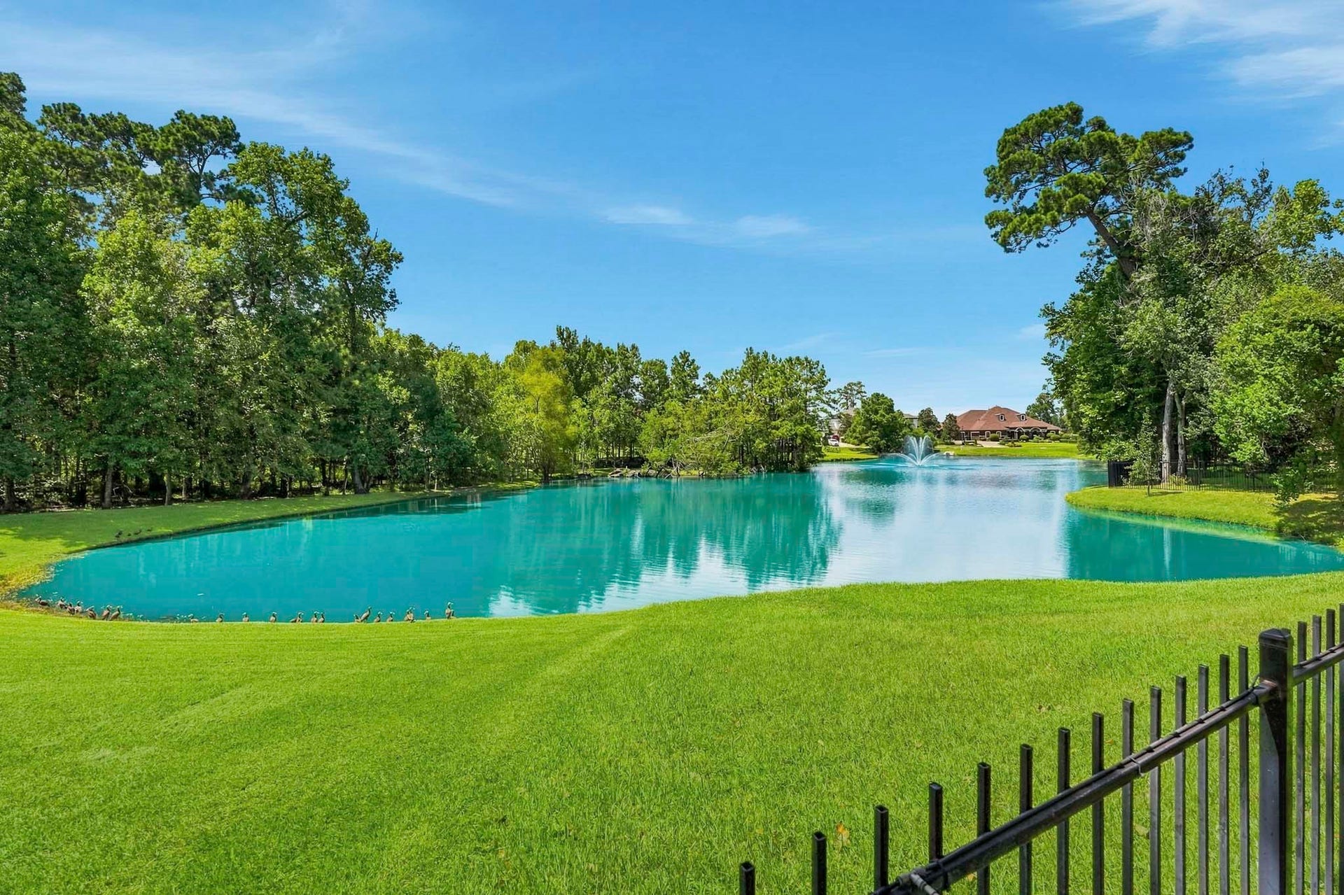 7611 Kings River Lane, Humble, TX 77346 Lakefront setting provides beautiful water views directly behind the property, creating a peaceful backdrop to the expansive homesite.