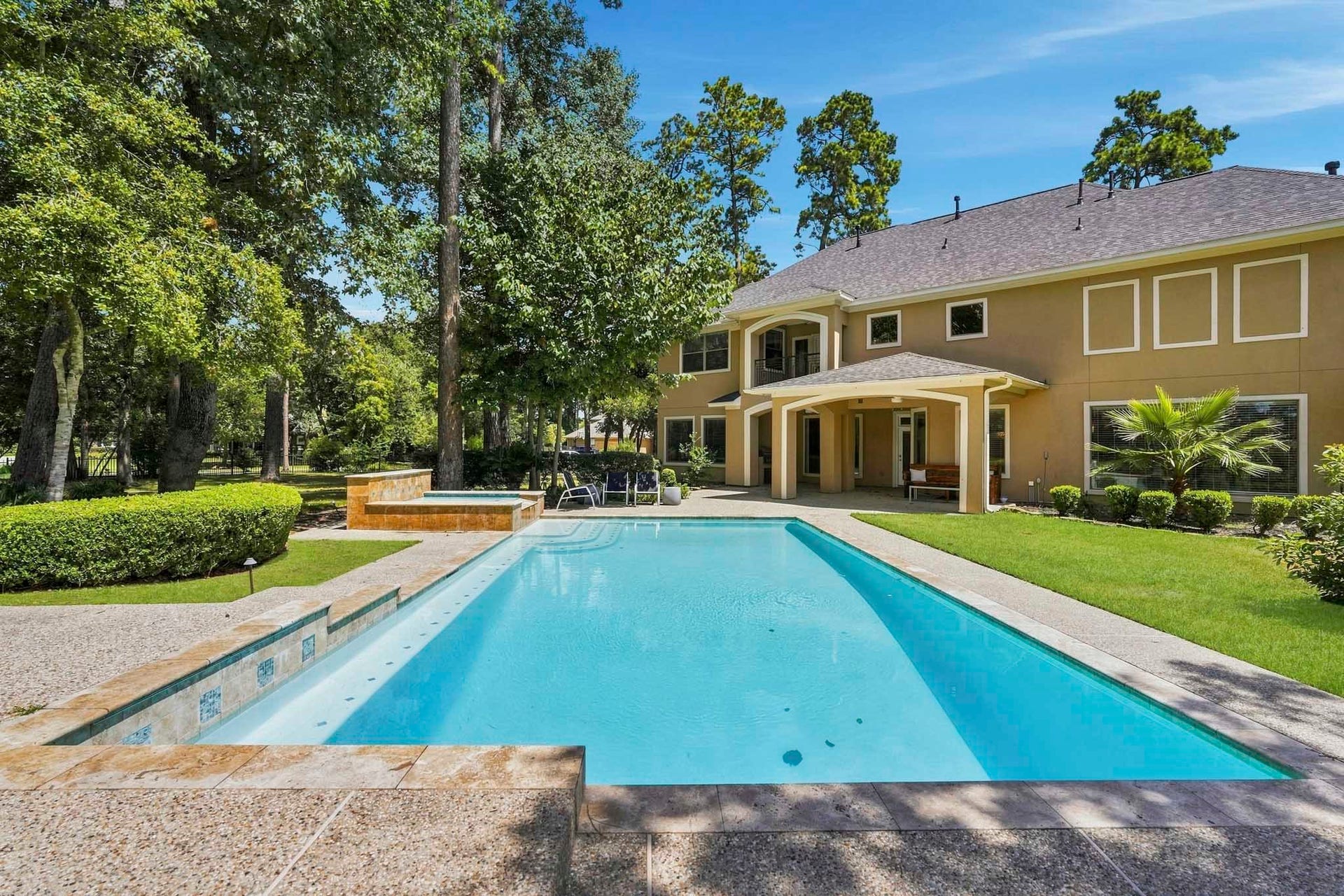 7611 Kings River Lane, Humble, TX 77346 Recently resurfaced swimming pool creates a resort-style setting with expansive surrounding deck space and views of the backyard.