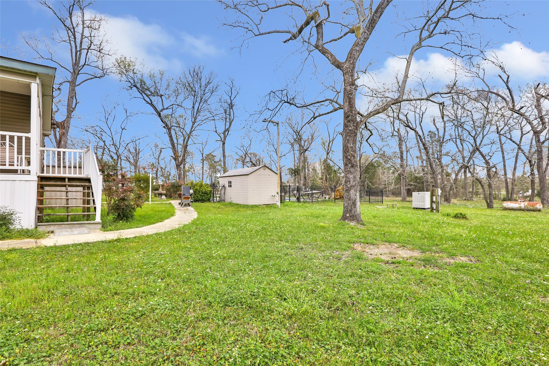 17659 E FM 1097 ROAD, Willis, TX 77378 SIDE OF HOME TO THE BACK LEADING TO THE POOL HOUSE AND POOL...