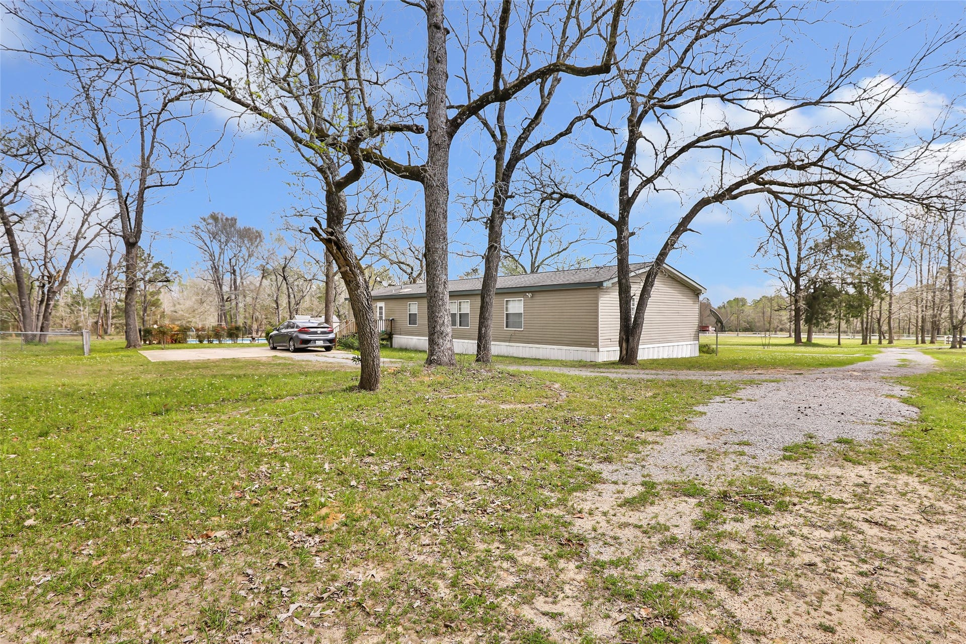 17659 E FM 1097 ROAD, Willis, TX 77378 BACK VIEW OF MAIN HOME, PROPERTY IS FENCED ON ALL SIDES AND HAS ELECTRONIC GATE IN FRONT...