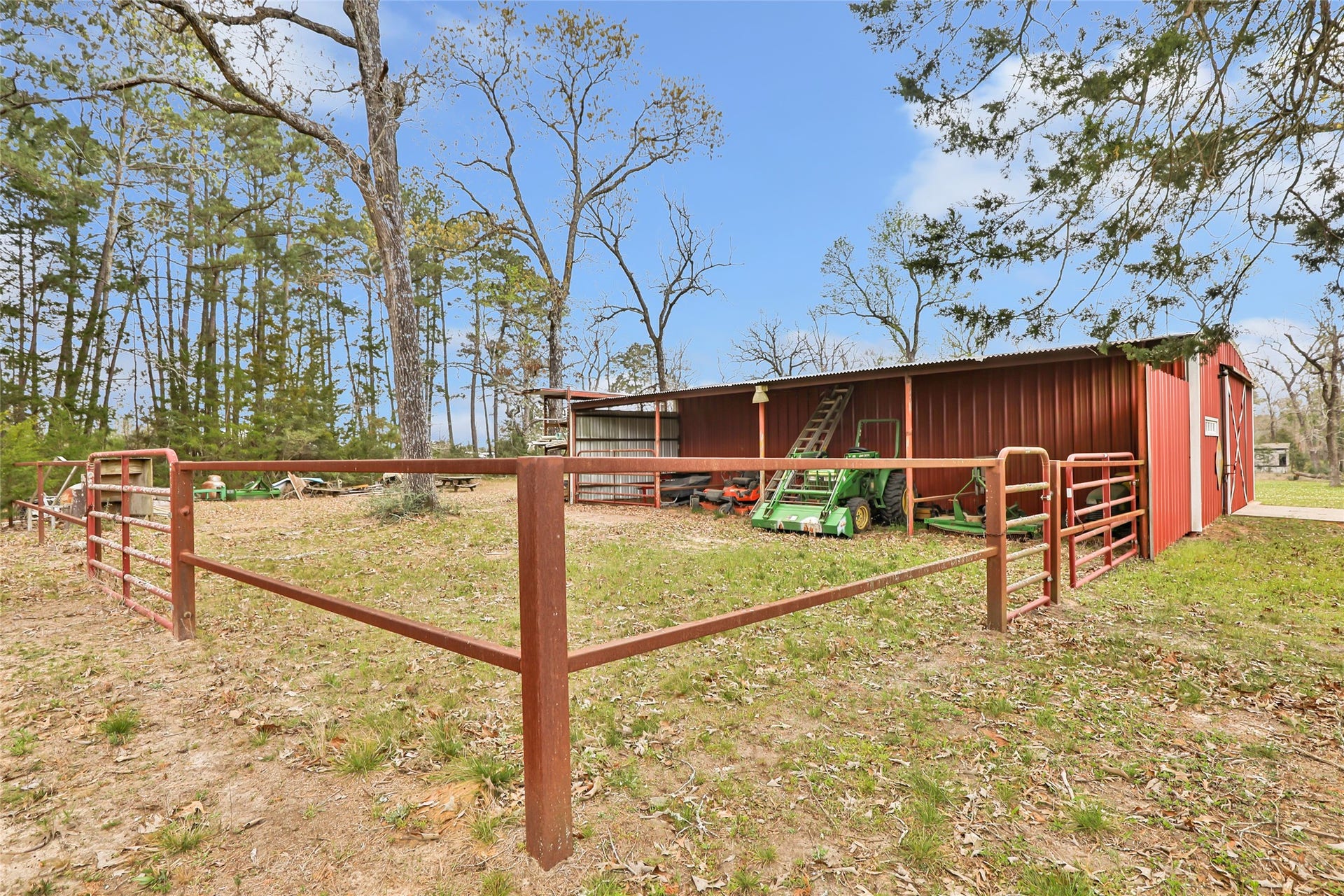 17659 E FM 1097 ROAD, Willis, TX 77378 BACK OF SHOP HAS 4 STALLS 10' WIDE AND 14' DEEP. POLE BARN IS 50 X 10 FEET & WIRED...