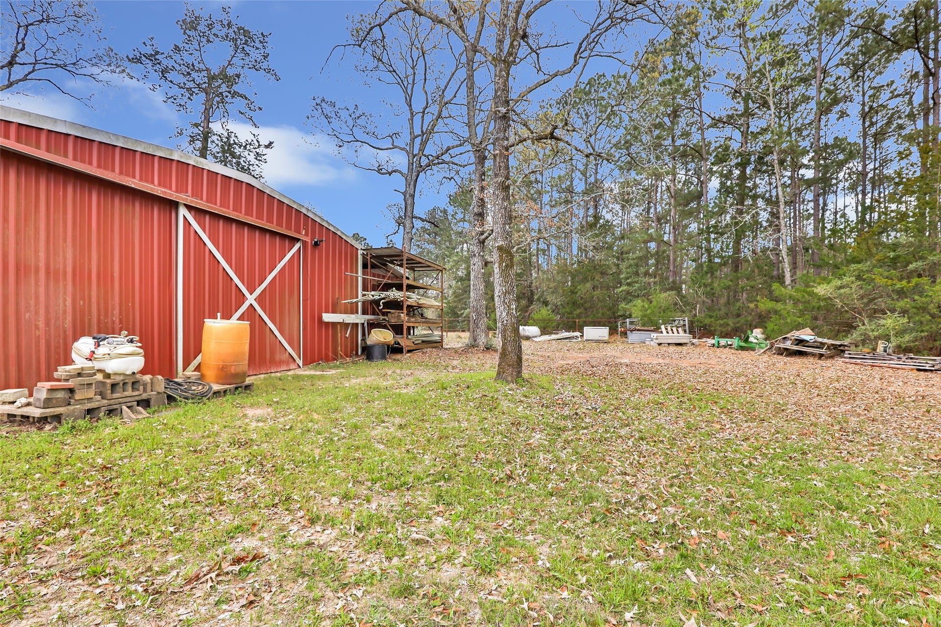 17659 E FM 1097 ROAD, Willis, TX 77378 BACK SIDE OF SHOP WITH EXTRA STORAGE AND PLENTY OF ROOM FOR 4-H OR FFA ANIMALS...