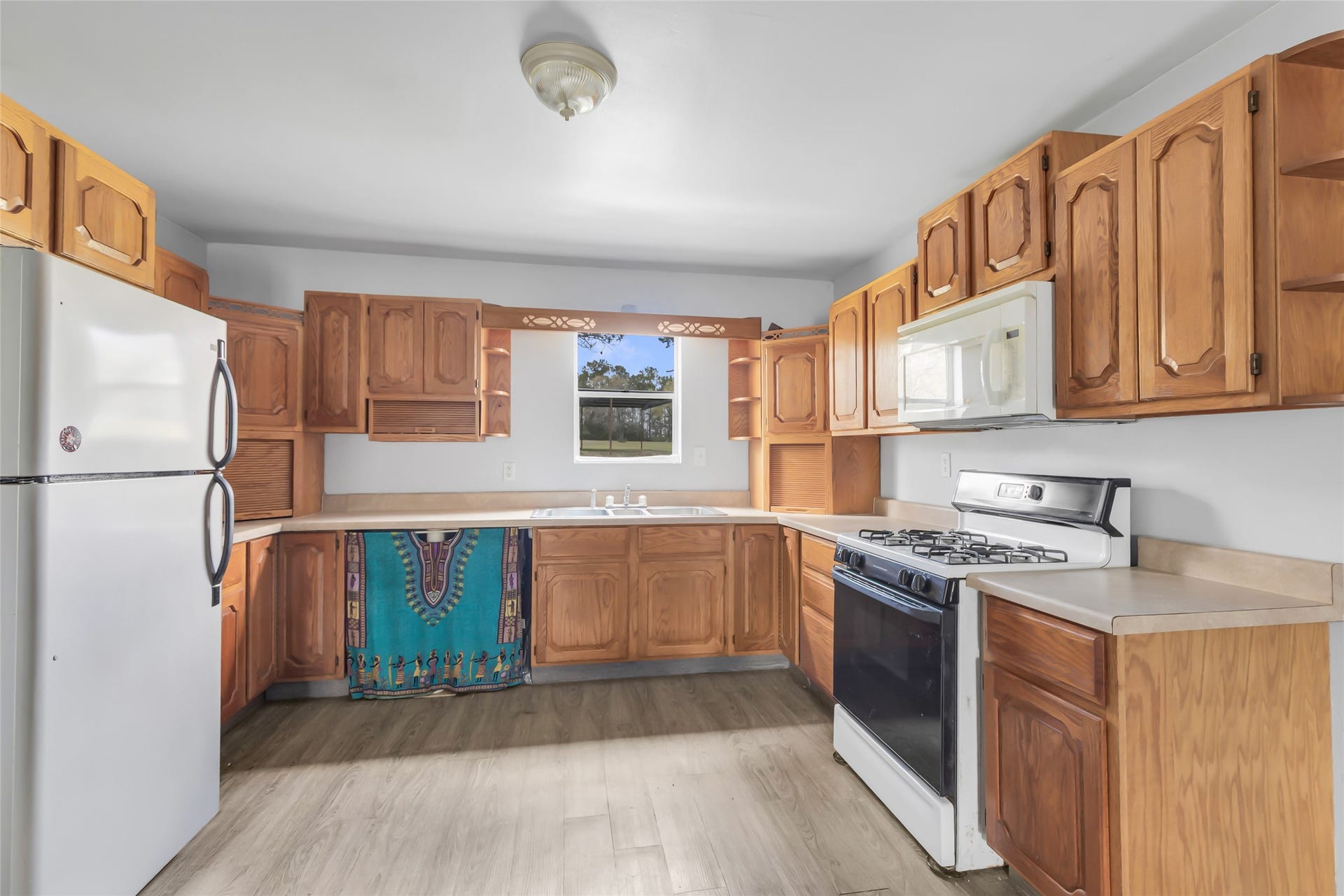 17659 E FM 1097 ROAD, Willis, TX 77378 SMALL HOME - VIEW OF KITCHEN, LOTS OF STORAGE...