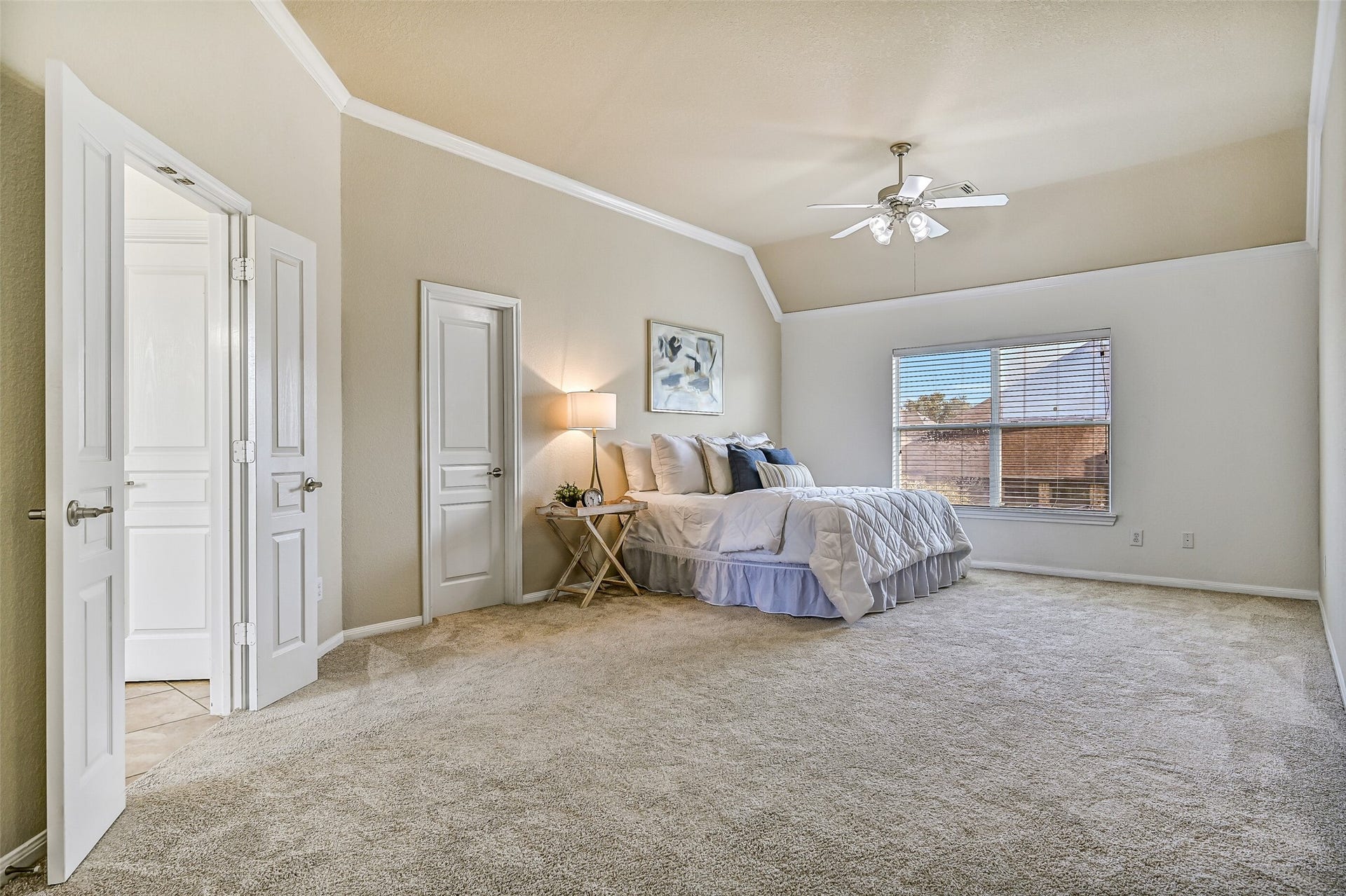2508 Rockygate Lane, Friendswood, TX 77546 From this angle, appreciate the full size of the primary bedroom and its seamless connection to the adjoining sitting area. Fresh carpet and neutral finishes create a move-in-ready backdrop, while dual walk-in closets provide exceptional storage rarely found in homes at this price point.