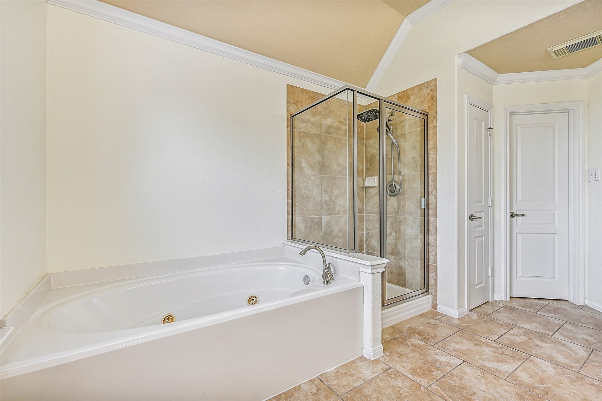 2508 Rockygate Lane, Friendswood, TX 77546 Relax and unwind in the jetted soaking tub or enjoy the separate glass-enclosed shower with a full tile surround. Combined with the spacious layout, dual closets, and vanity area, this bathroom delivers the comfort and functionality expected in a true owner's retreat.