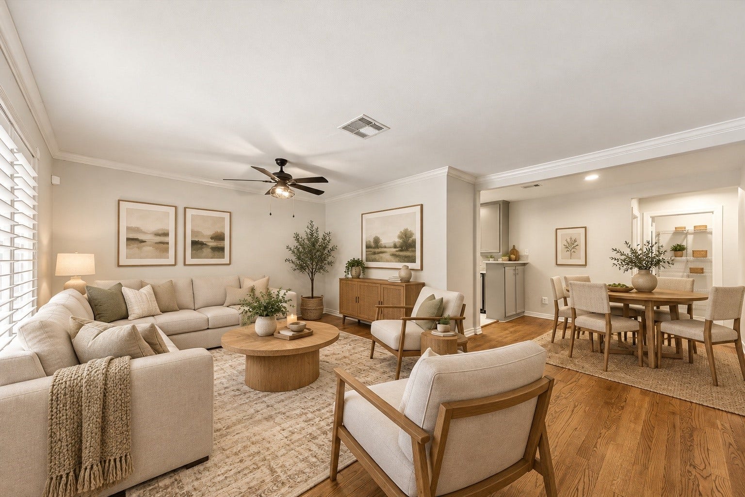 View from the dining area into the galley kitchen, featuring stainless steel appliances, including a stove updated in 2022, plus convenient access to the garage through the adjacent door with a built-in pet door.