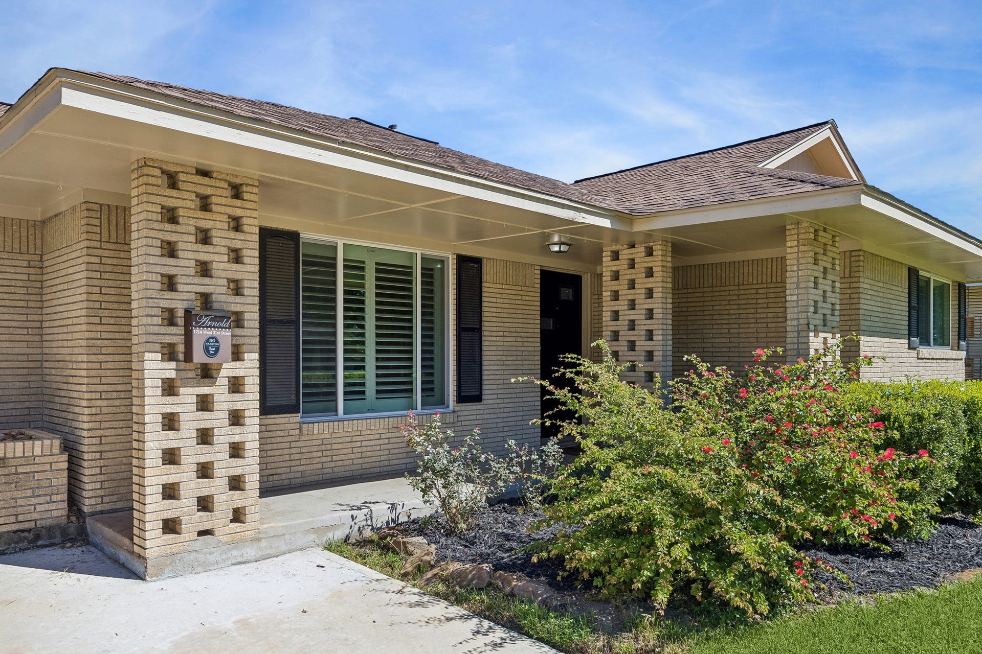 The backyard also includes a storage shed, adding practical space for tools, lawn equipment, or seasonal storage alongside this oversized yard.