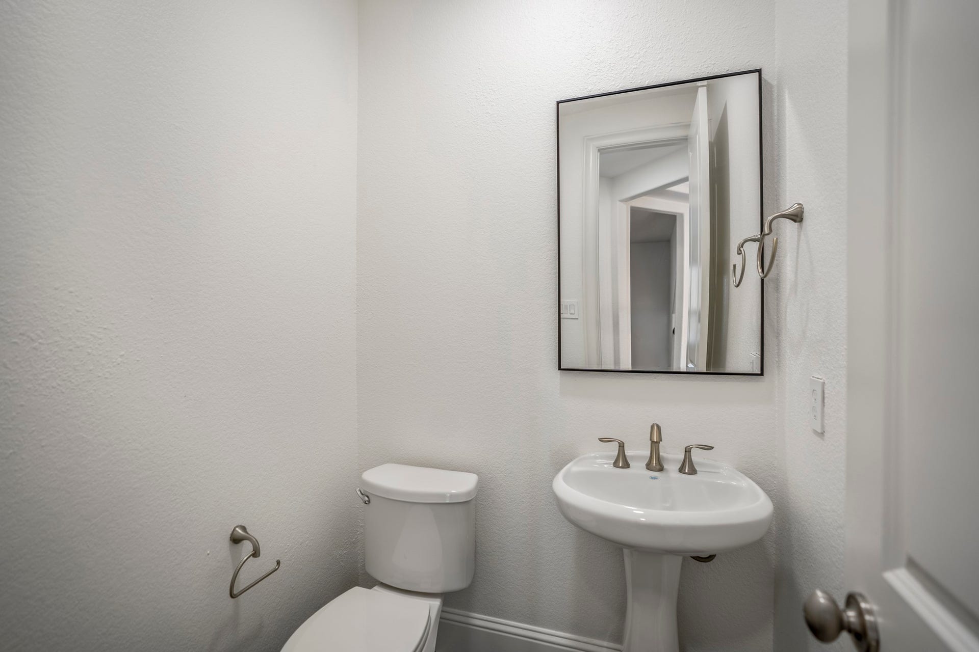 The second floor offers a powder bath, which offers convenient central access, especially from the gameroom.