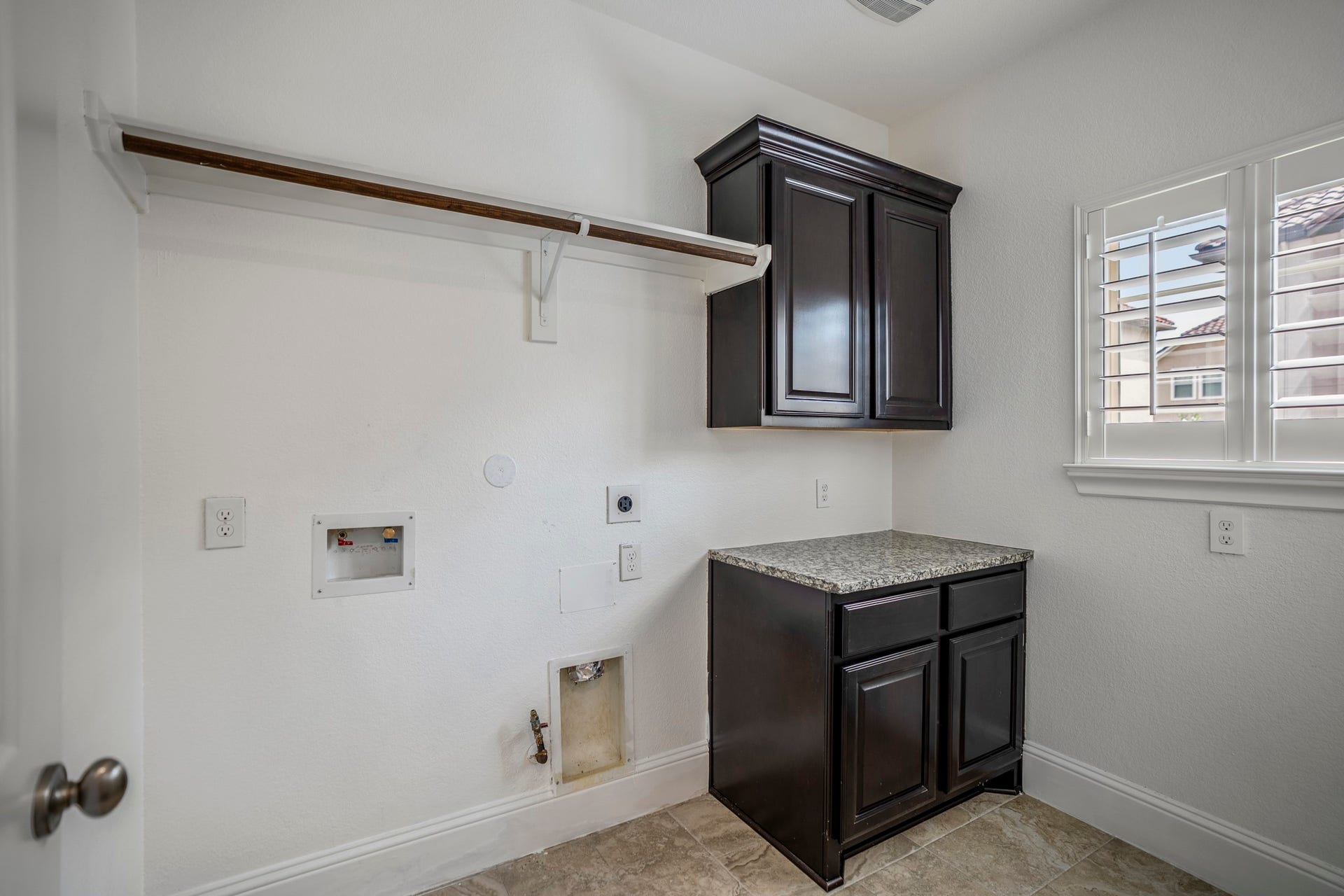 Large utility room is conveniently located on the second floor, near the primary bedroom.