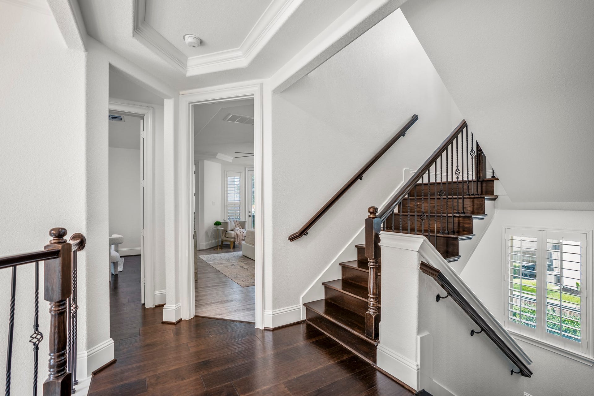 The second floor is thoughtfully designed to balance work, relaxation, and recreation with a luxurious primary suite, private home office, and expansive game room.