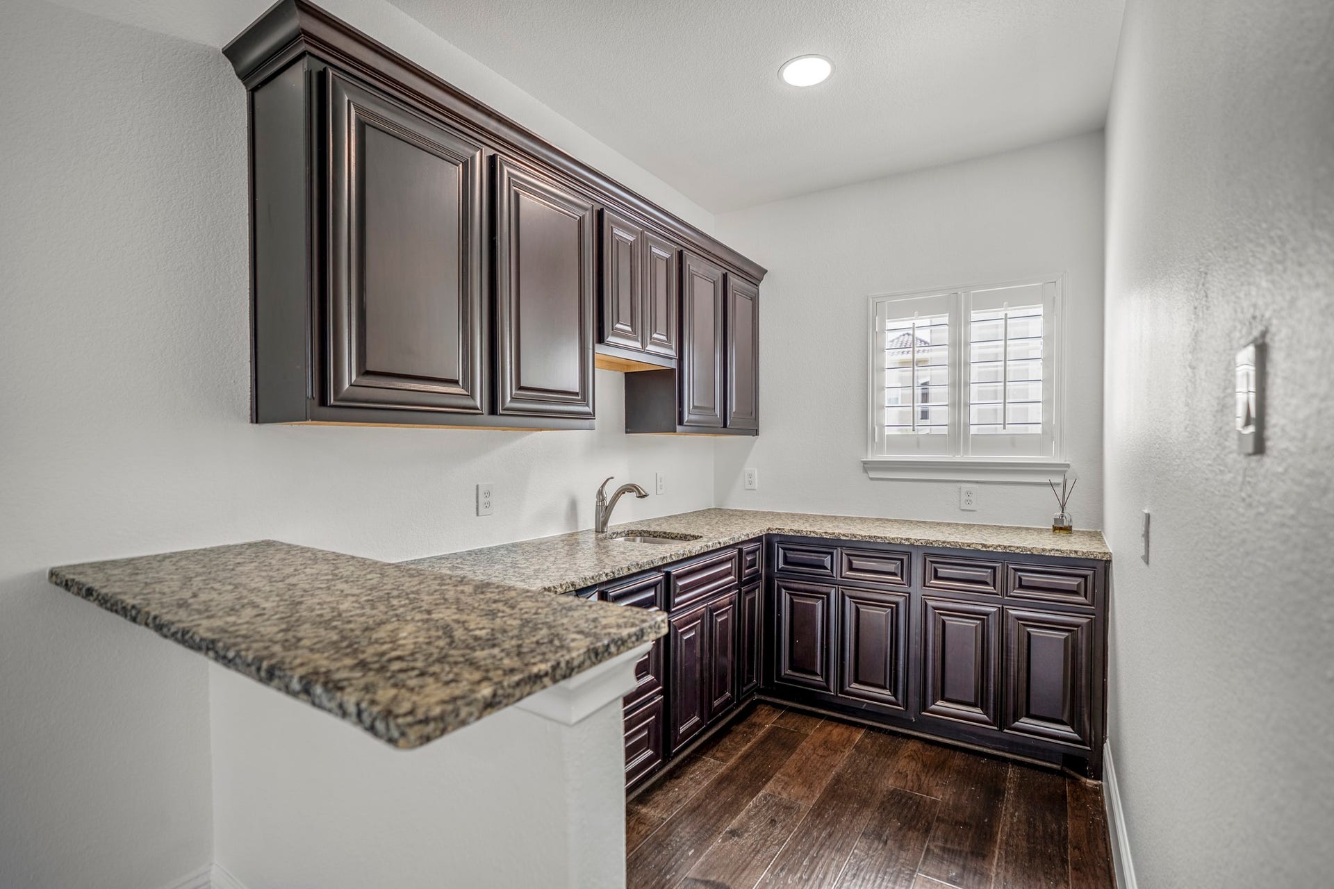 Close up of the bar area, with a beverage fridge and sink. What more could you need?