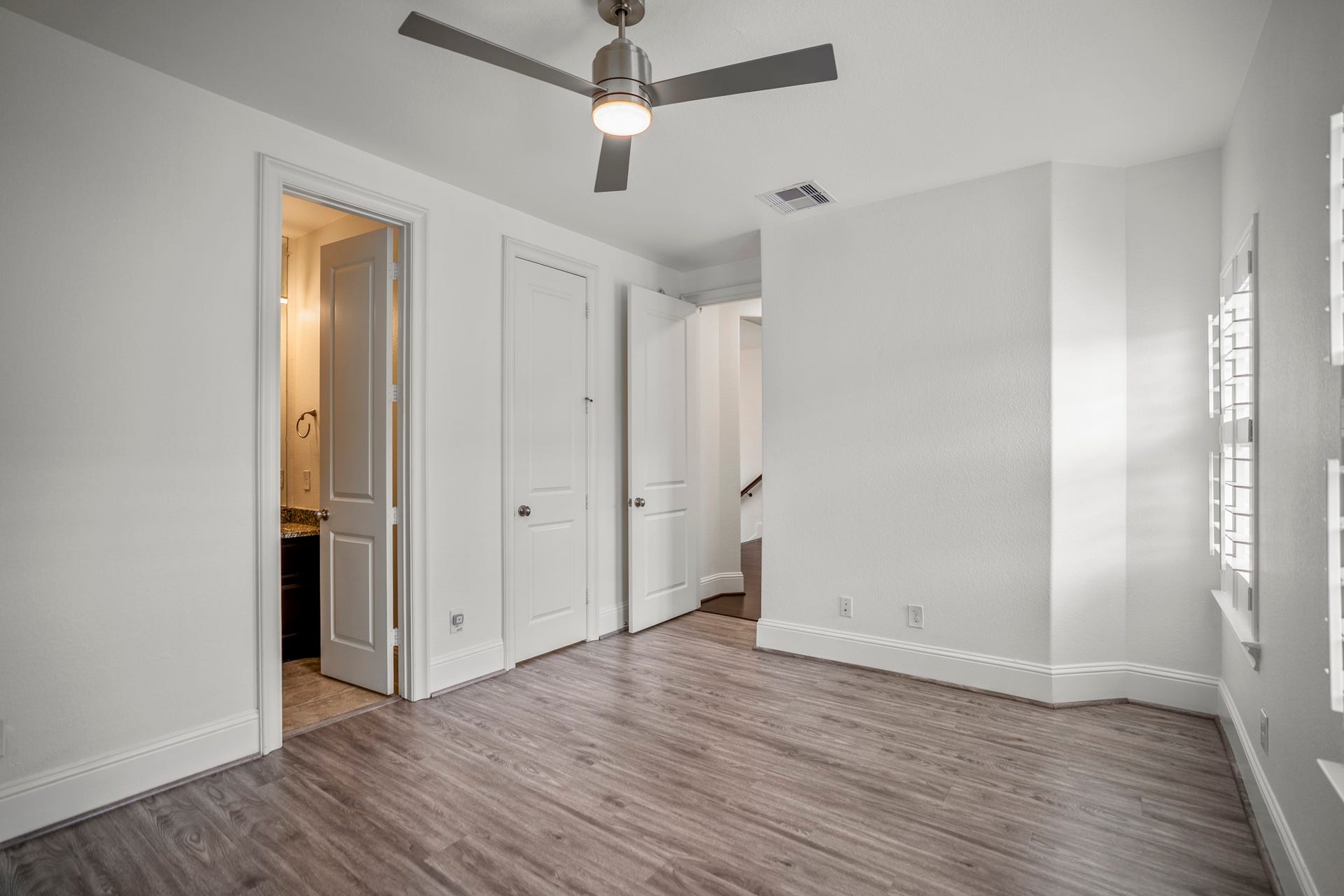 Head up to the third floor where you will find three additional bedrooms. This one has an ensuite full bathroom.