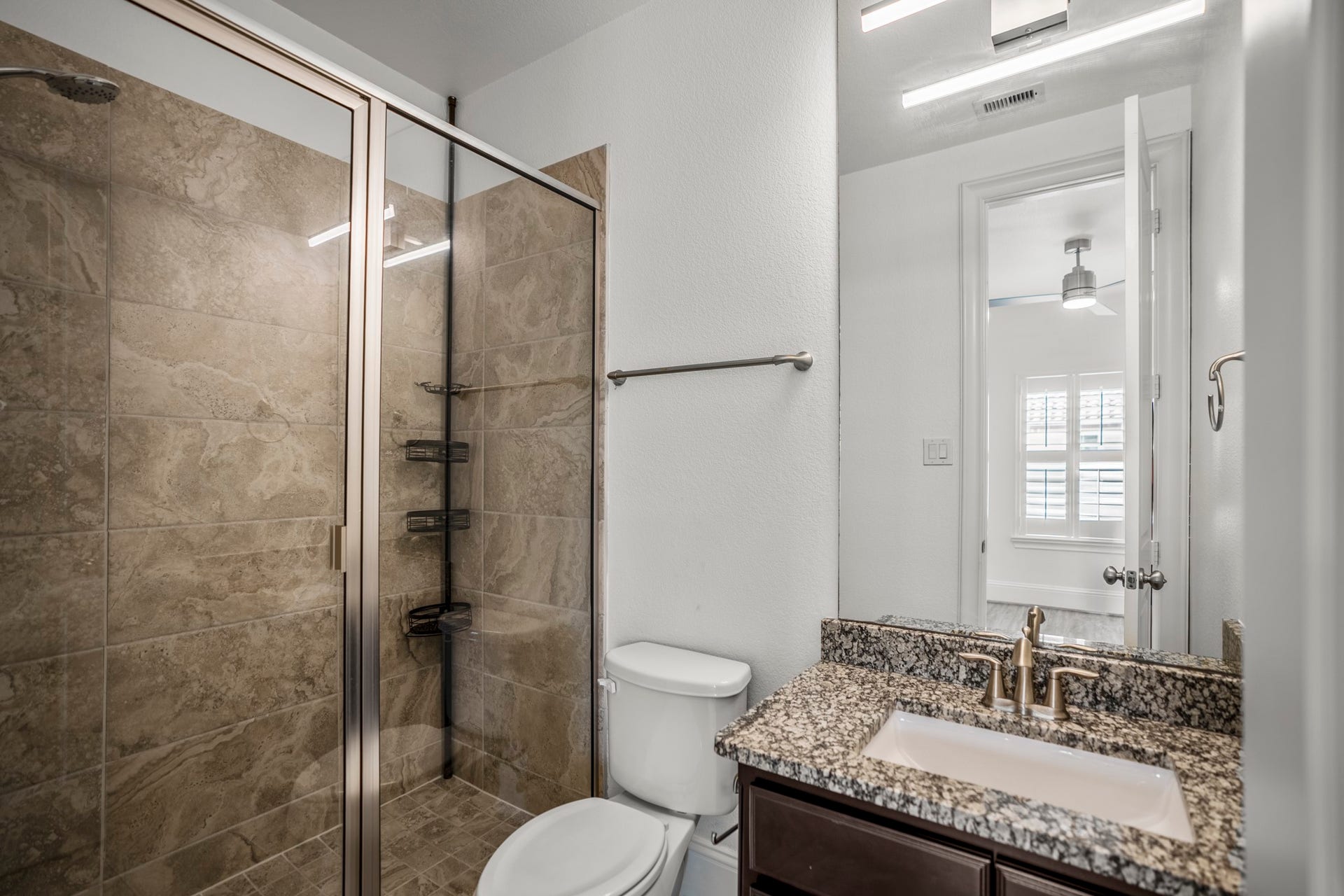 Ensuite full bathroom, attached to one of the secondary bedrooms on the third floor.