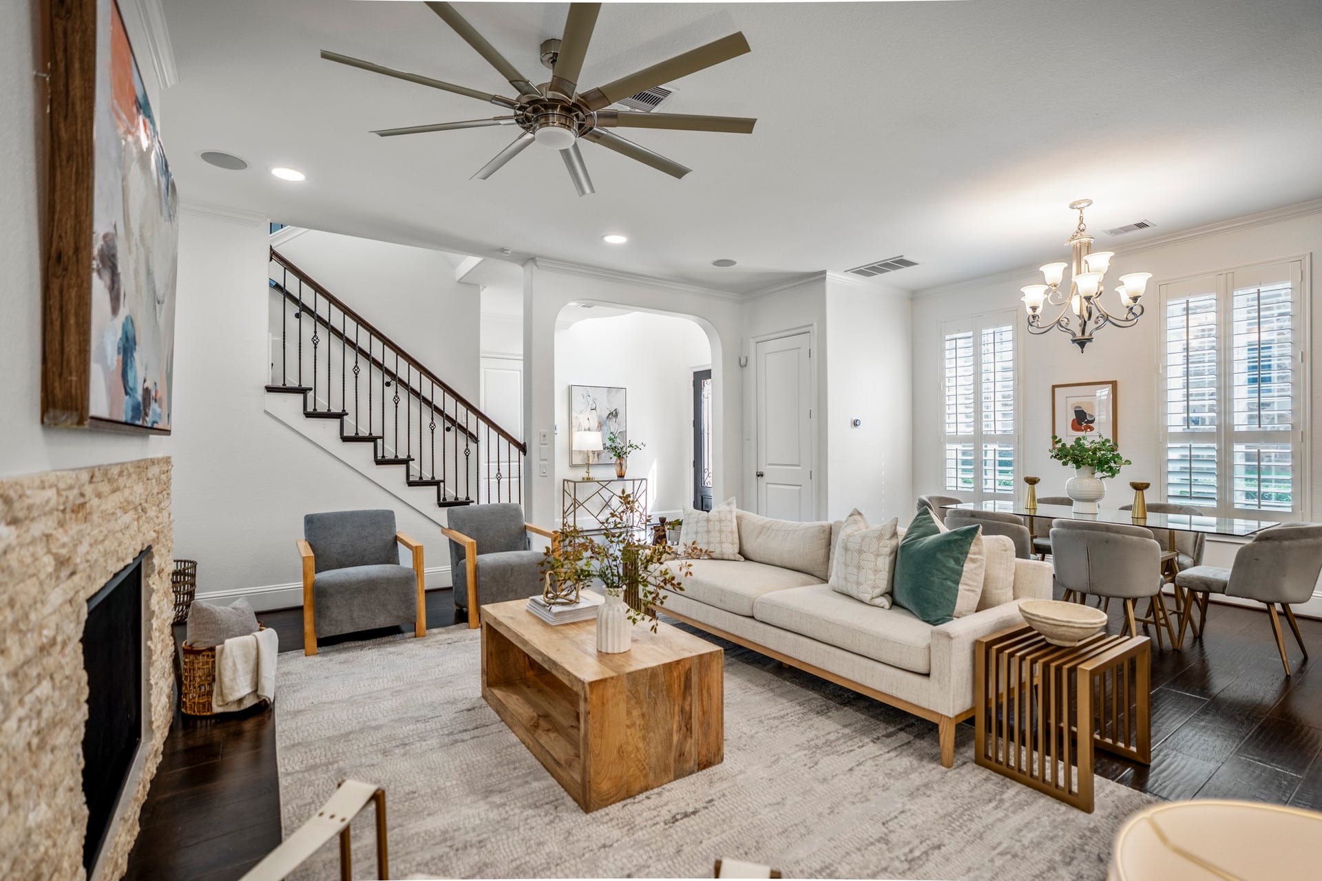 Bathed in natural light, the inviting living room serves as the heart of the home, perfectly positioned within the open floor plan.