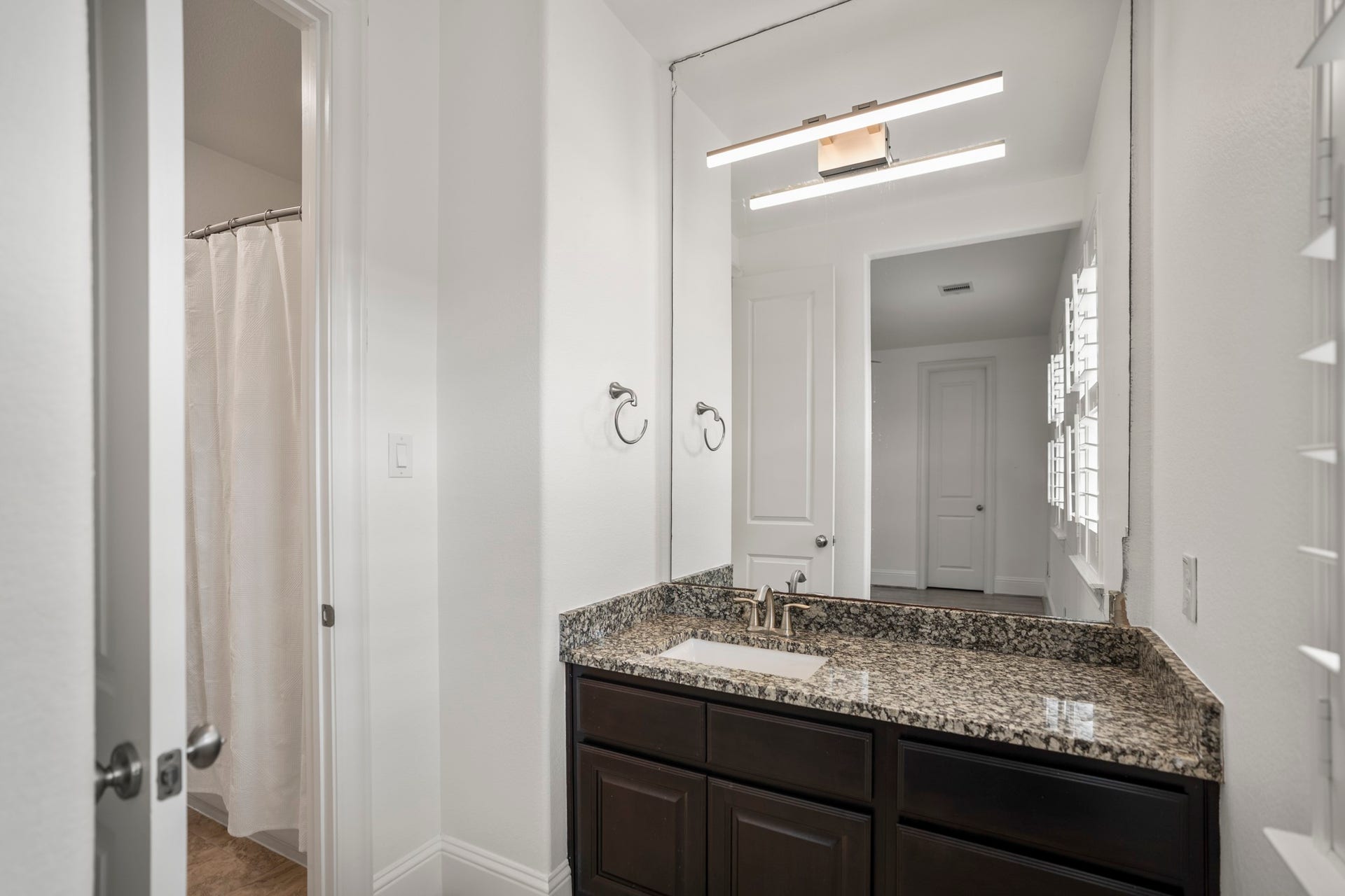 The separate vanity space for the third bedroom/shared bath.