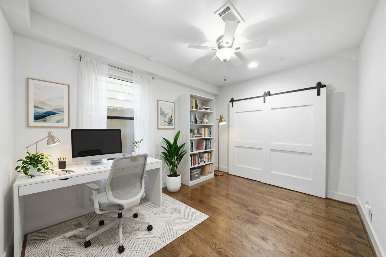 1215 Summer Street, #C, Houston, TX 77007 1st floor guest bedroom - virtually staged as an office. Good sized closet behind the sliding barn doors!