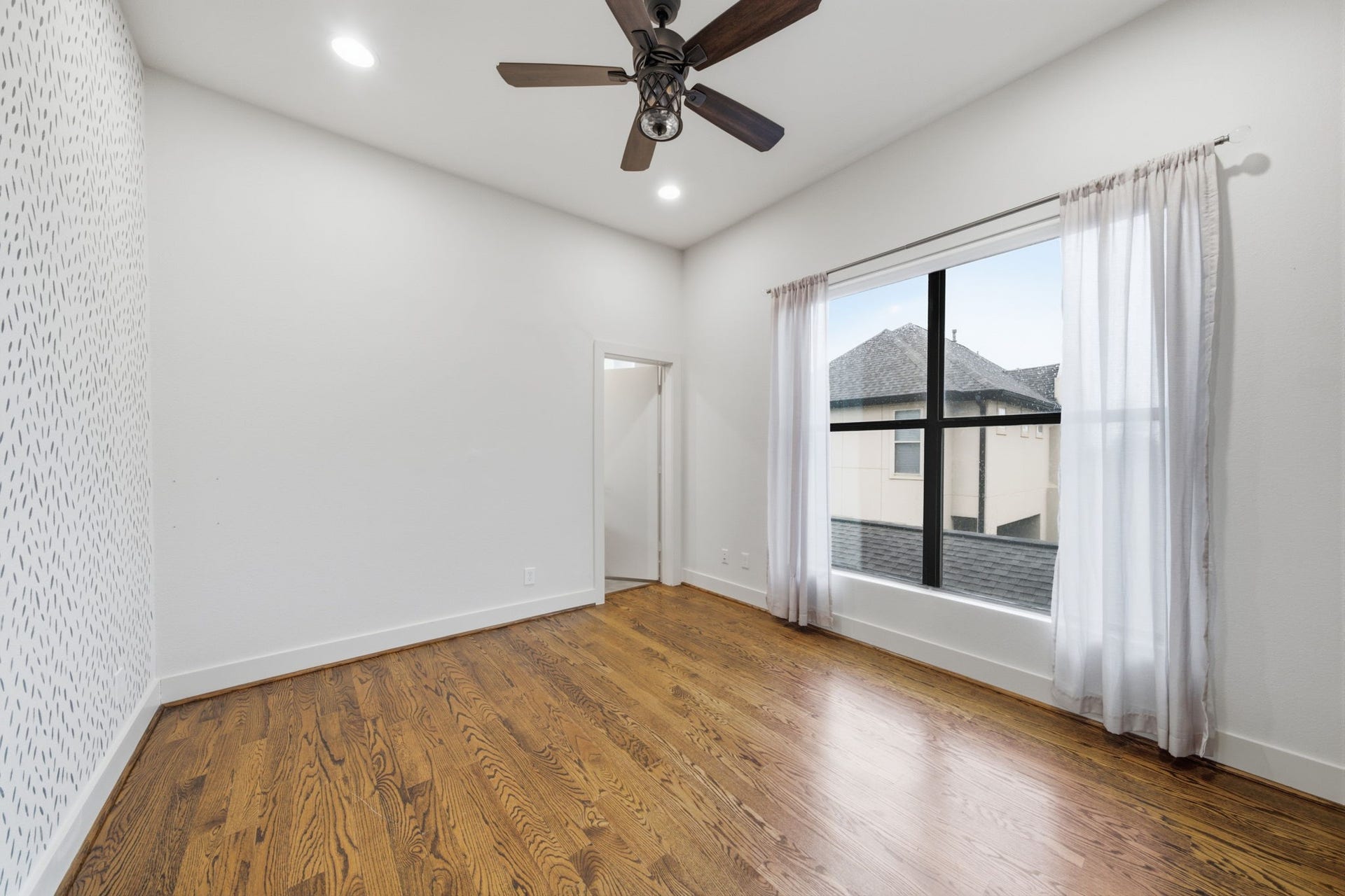 1215 Summer Street, #C, Houston, TX 77007 3rd floor - Guest bedroom. Hand painted feature wall on the left. LARGE WINDOWS on the right. Guest bathroom through the door