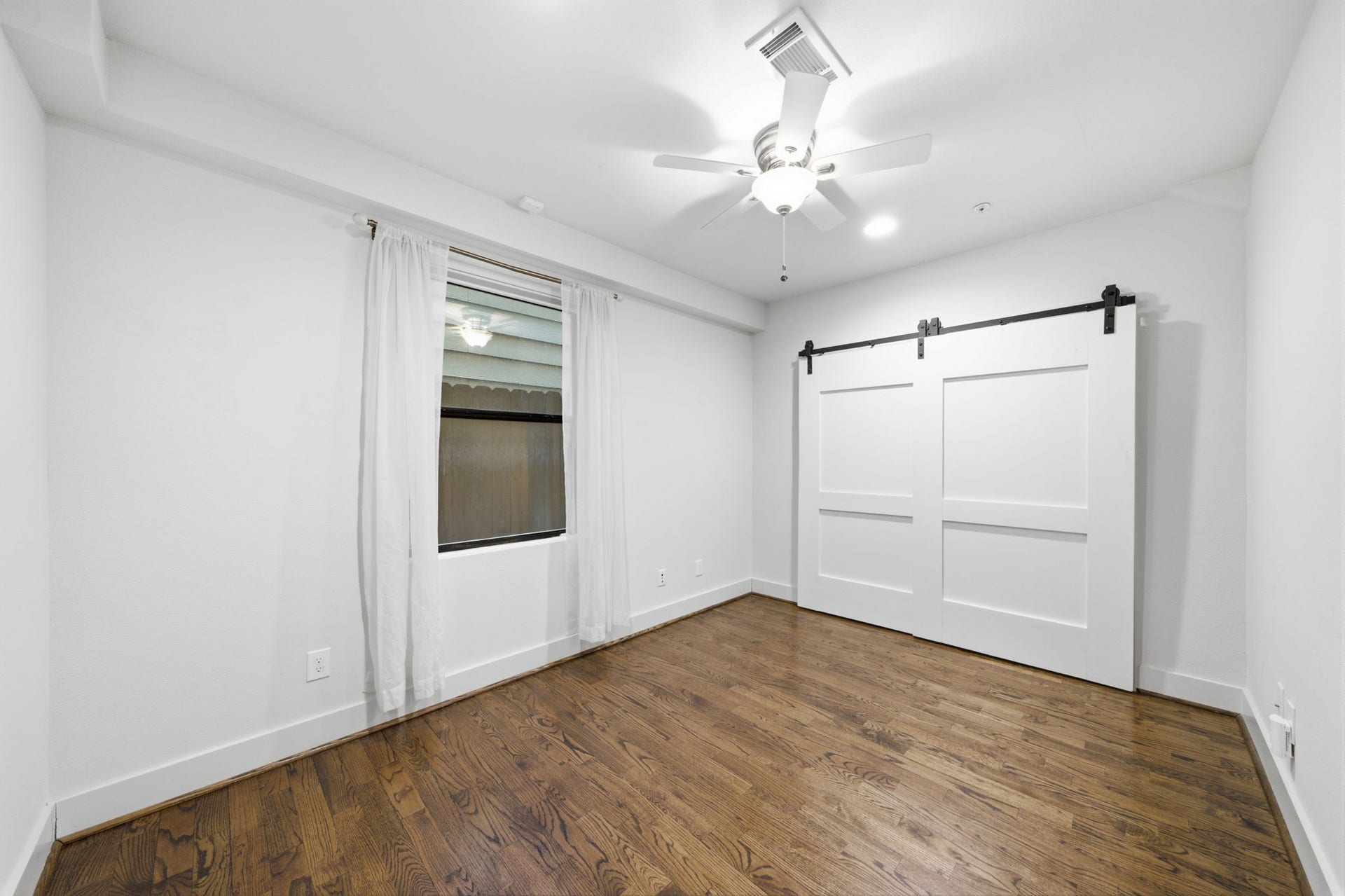 1215 Summer Street, #C, Houston, TX 77007 1st floor - Another guest bedroom down here. Good sized closet behind the sliding barn doors!