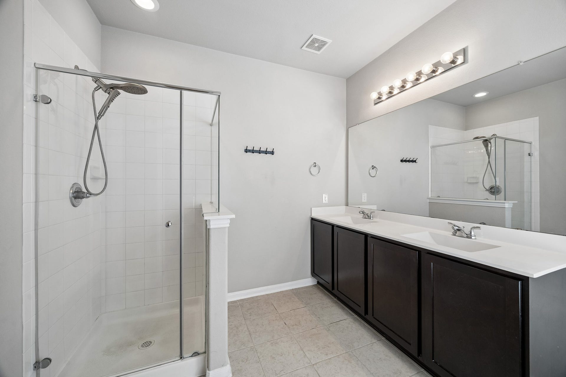 21264 Flowering Crape Myrtle Drive, Porter, TX 77365 Look at the double vanity sinks, separate shower with a tub in the Primary bath.