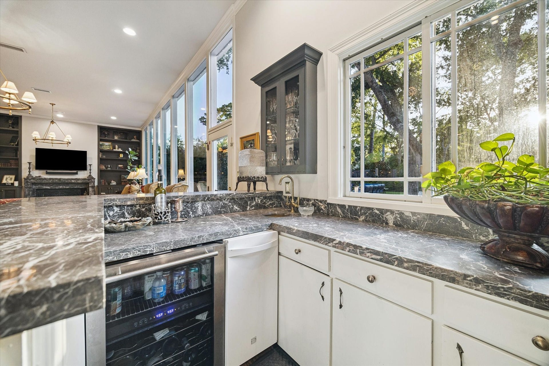 14 Stonegate Drive, Houston, TX 77024 The wet bar features a serving window, ice maker and wine refrigerator.