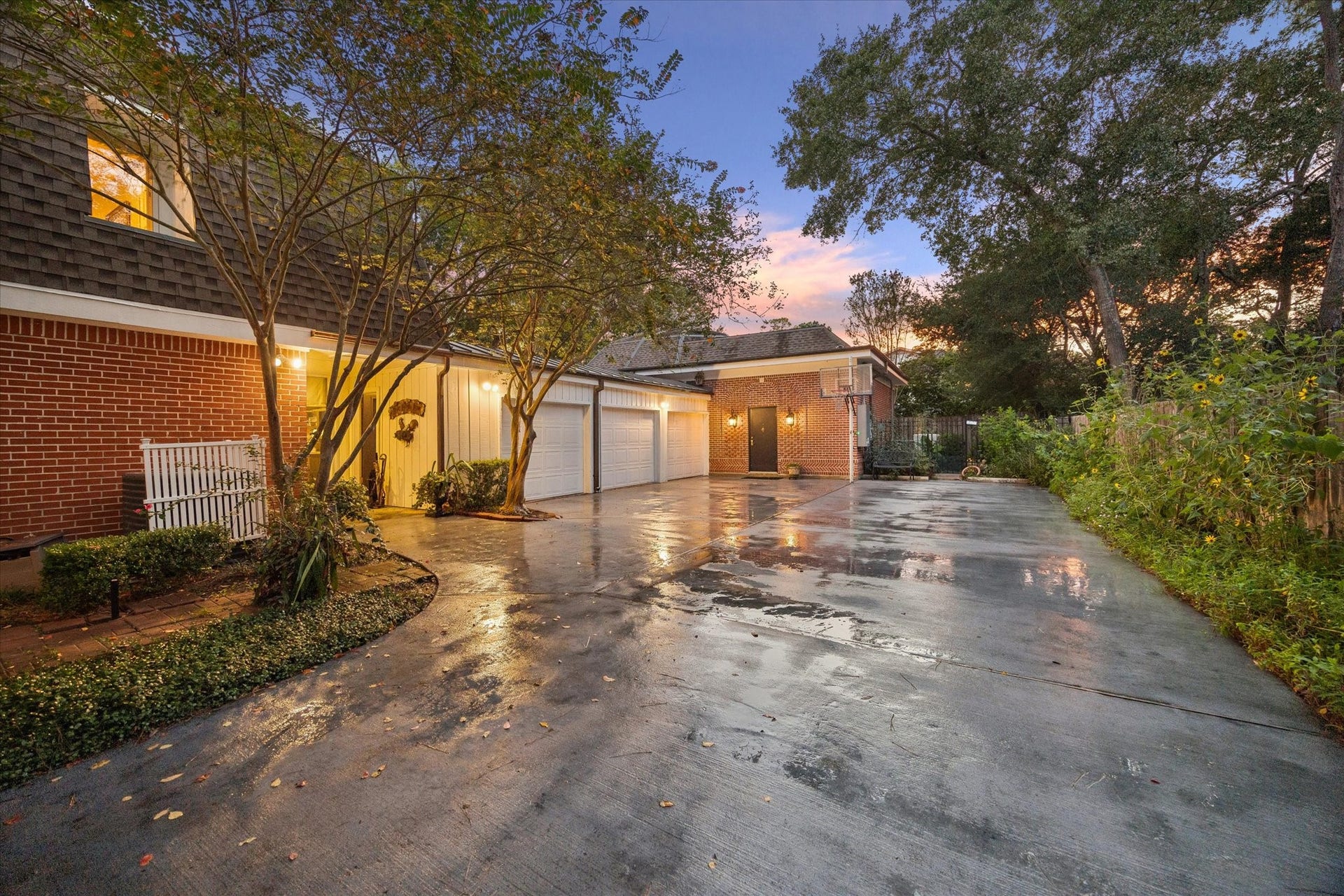 14 Stonegate Drive, Houston, TX 77024 Gated motor court with 3-car garage, access to pool house, basketball goal and dog run behind the pool house.