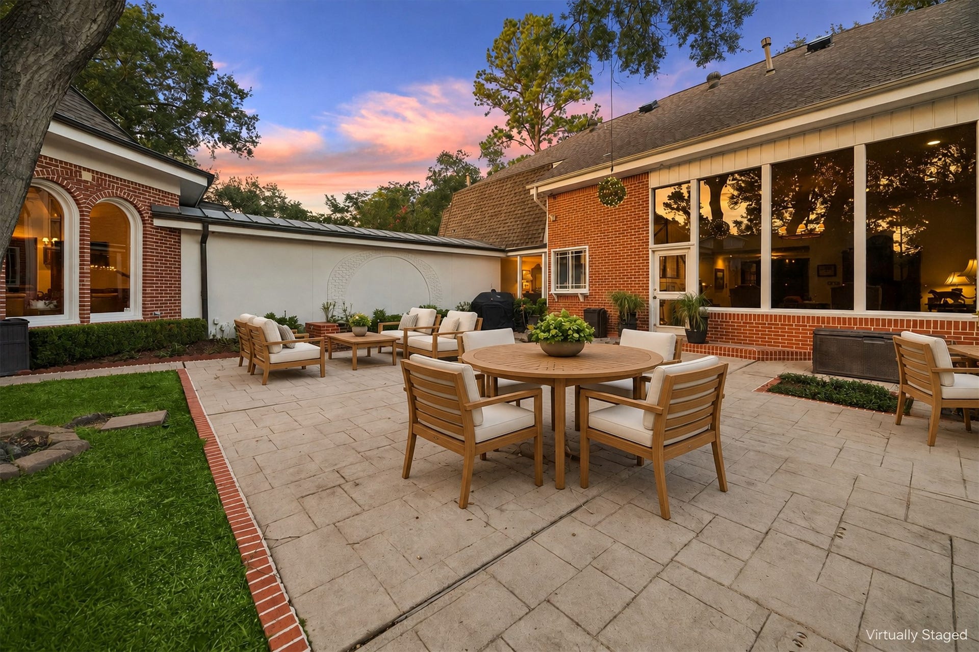14 Stonegate Drive, Houston, TX 77024 Virtually Staged - Discover the perfect outdoor retreat with an expansive back patio designed for cozy fire pit gatherings, elegant al fresco dining, and multiple lounging areas to relax and entertain.