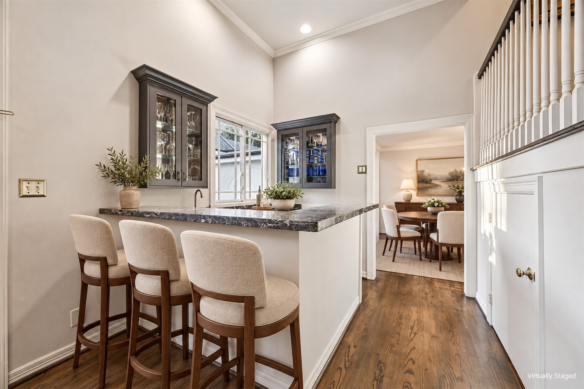 14 Stonegate Drive, Houston, TX 77024 Virtually Staged - Wet bar seamlessly connects the living room and formal dining, perfect for entertaining in style.