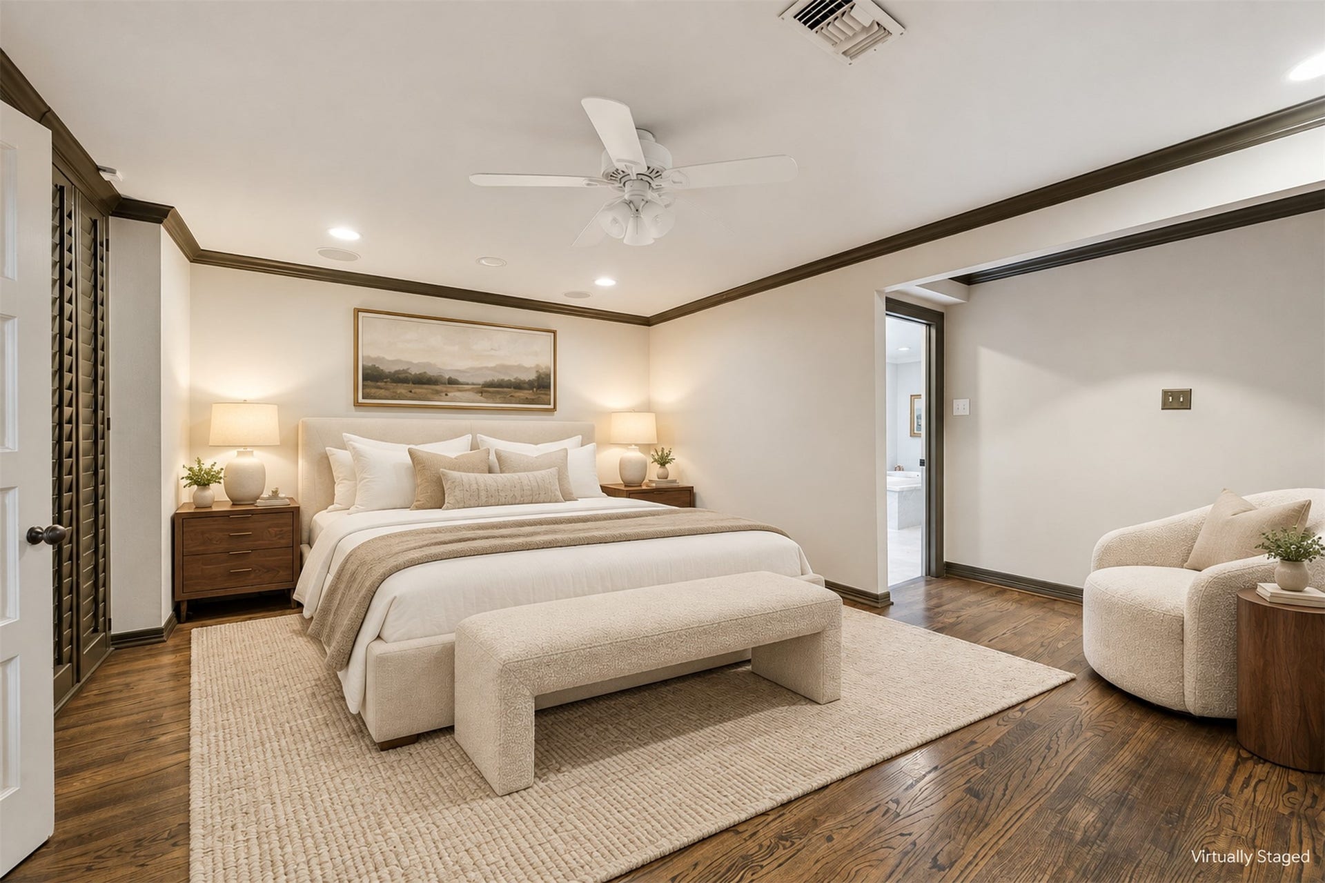 14 Stonegate Drive, Houston, TX 77024 Virtually Staged - The primary bedroom features elegant built-in shelving, rich oak floors, and a serene ambiance great for relaxation.