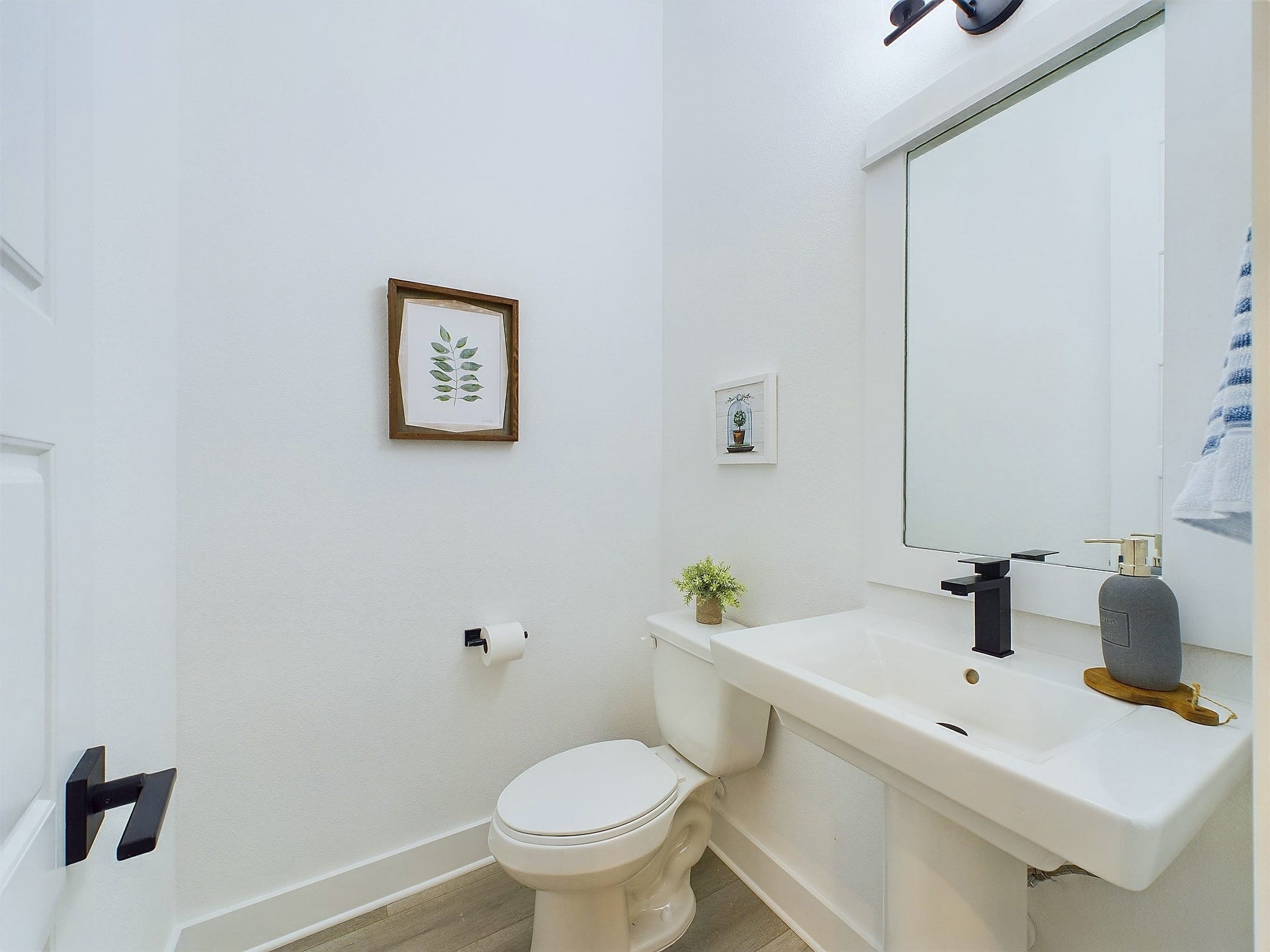 The powder room is conveniently located on the first floor. Model home photos and 3D tour - FINISHES & FLOOR PLANS WILL VARY!