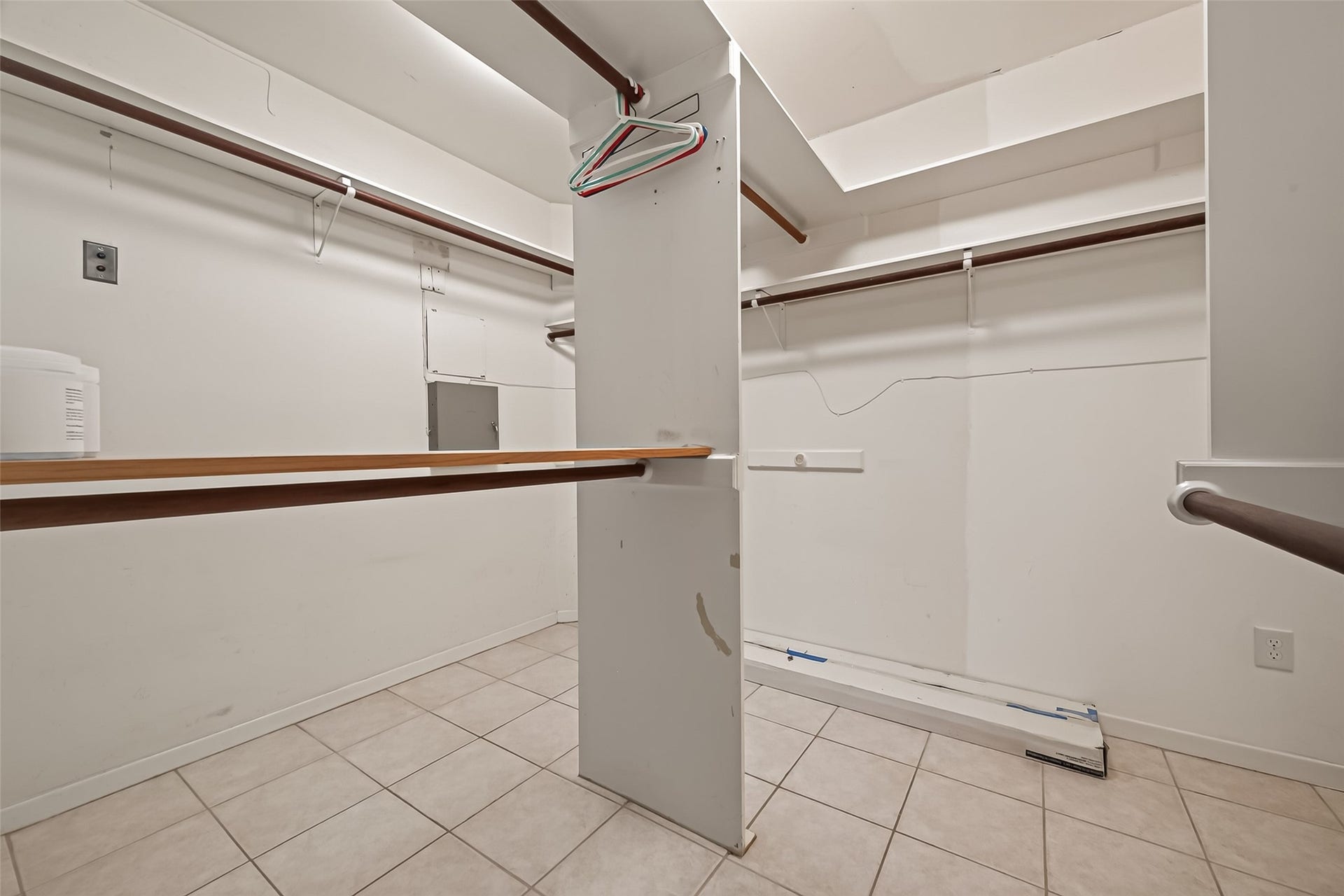 Check out the primary walk in closet! Hanging space and built in shelves for days!