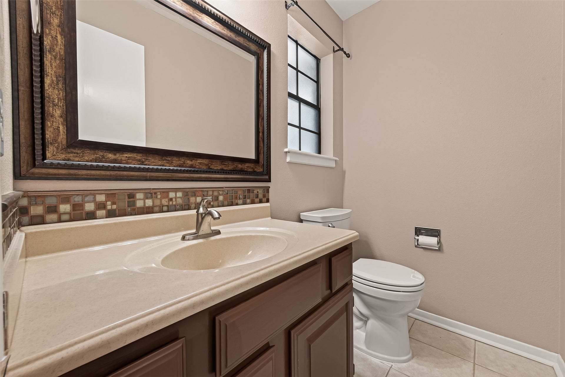 Pretty powder room off the utility room.