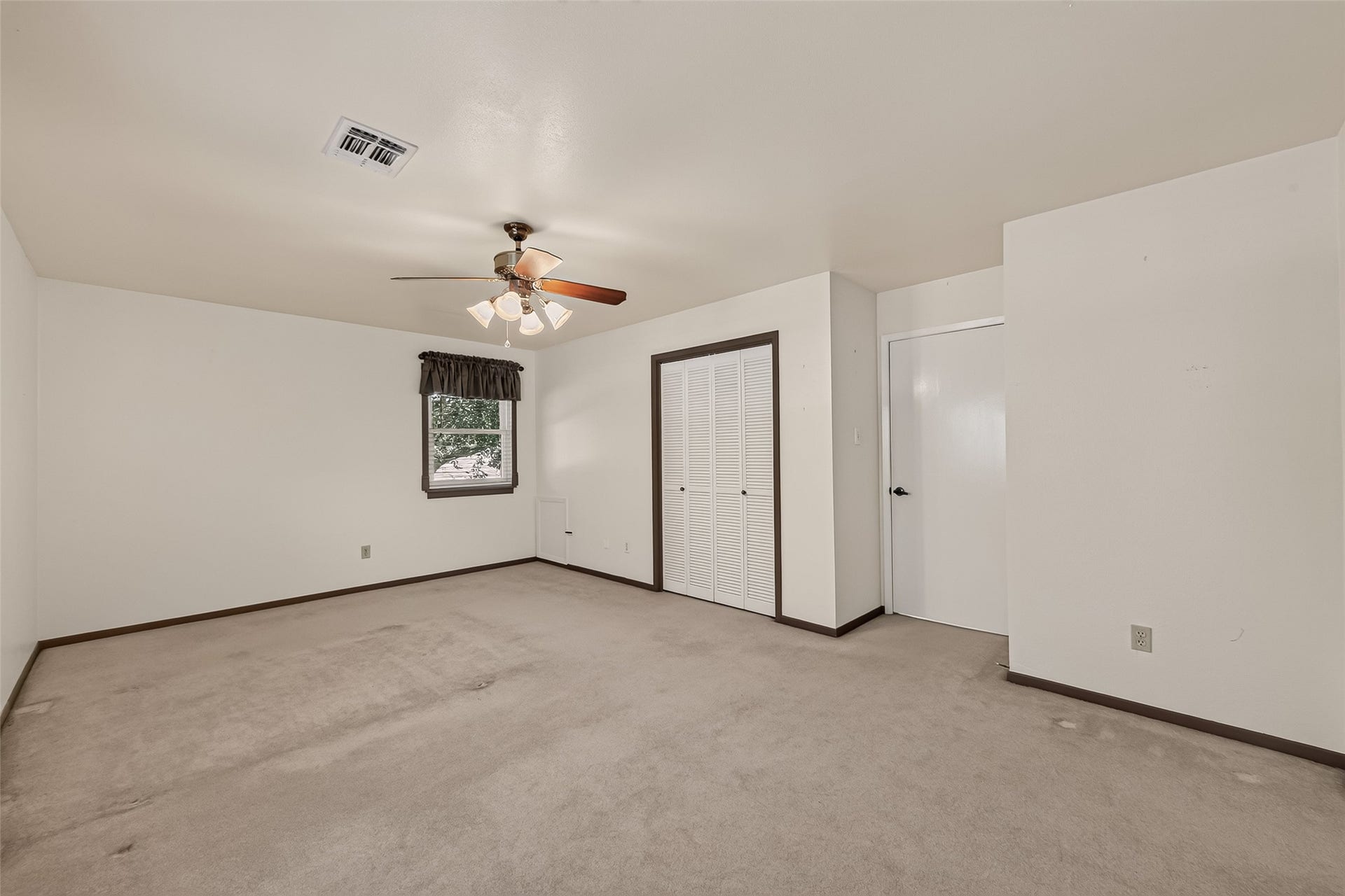 This is another upstairs guest bedroom. It's oversized and could also be game room or media space.