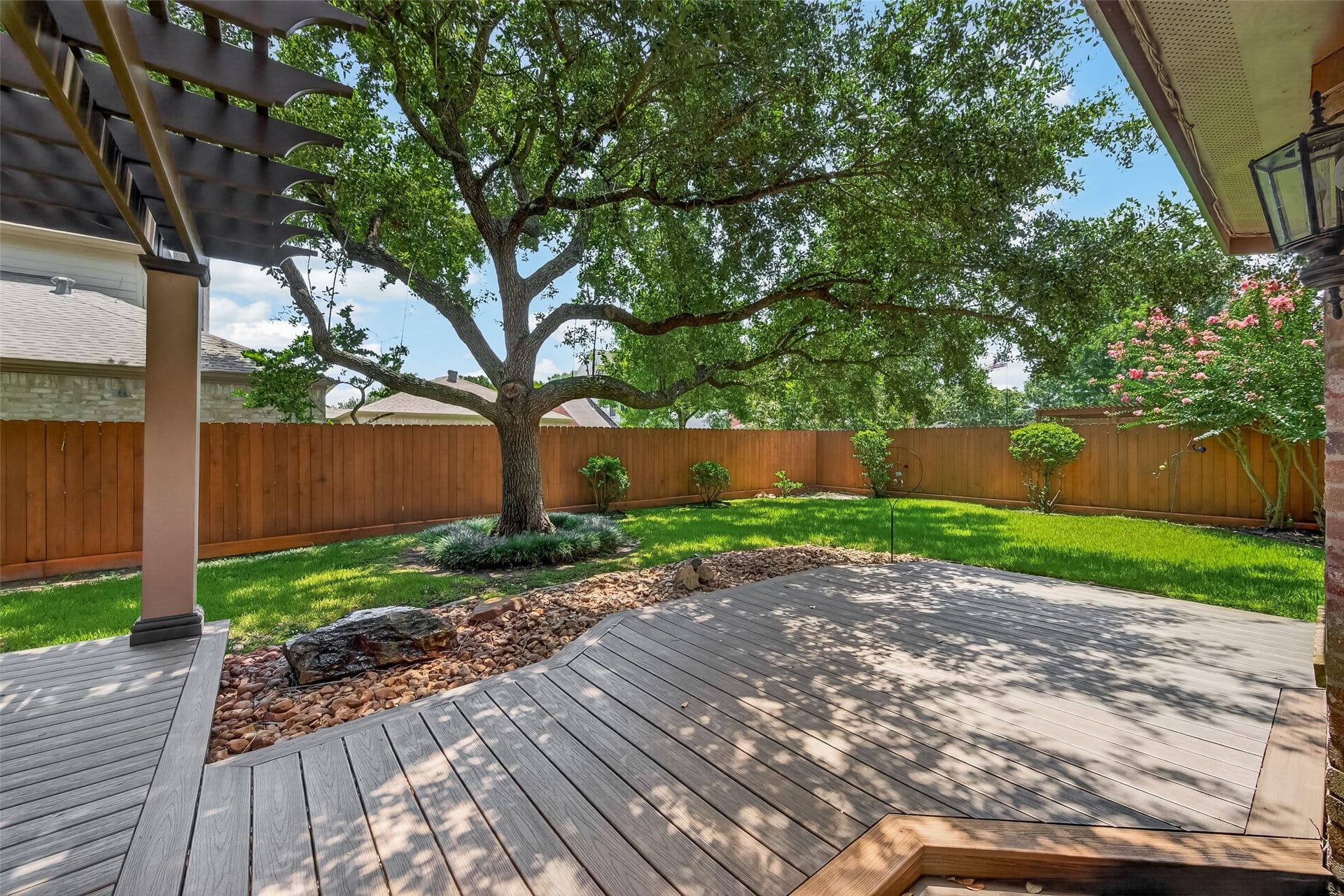 Trex deck patio and a large rock fountain water feature which is quite soothing! And the back french doors have a Rollac roll up security door.