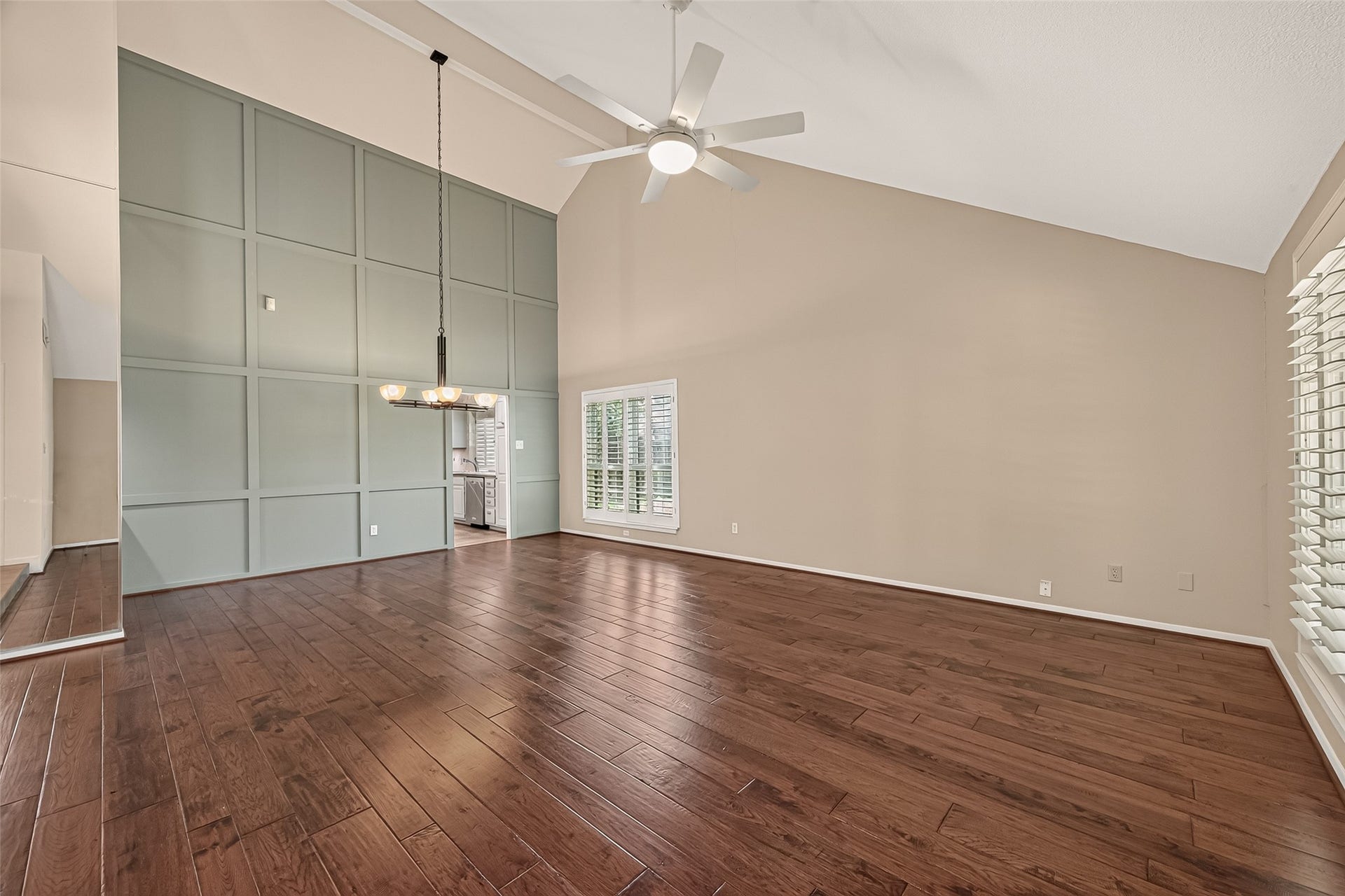 The box molding accent wall in the living area is tastefully done and adds architectural depth to this space.