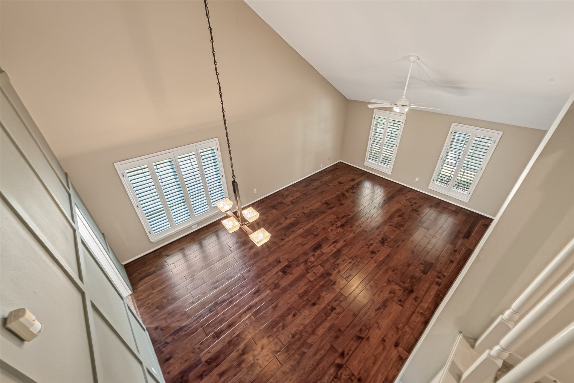 Birdseye view of the living room looking down from the second floor landing.