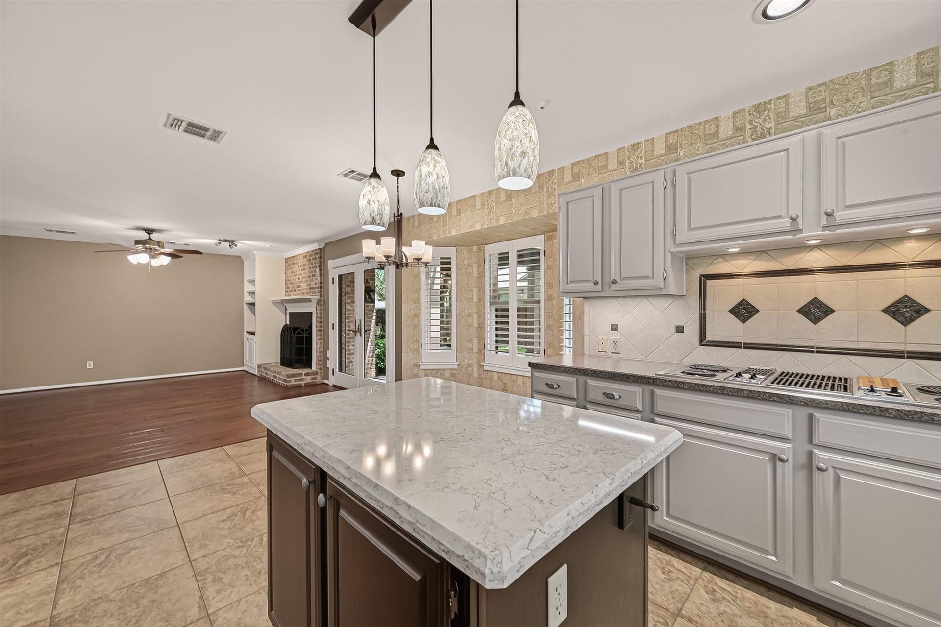 Island kitchen offers counter and cabinet space galore. All of your gadets will have a home with room to spare.
